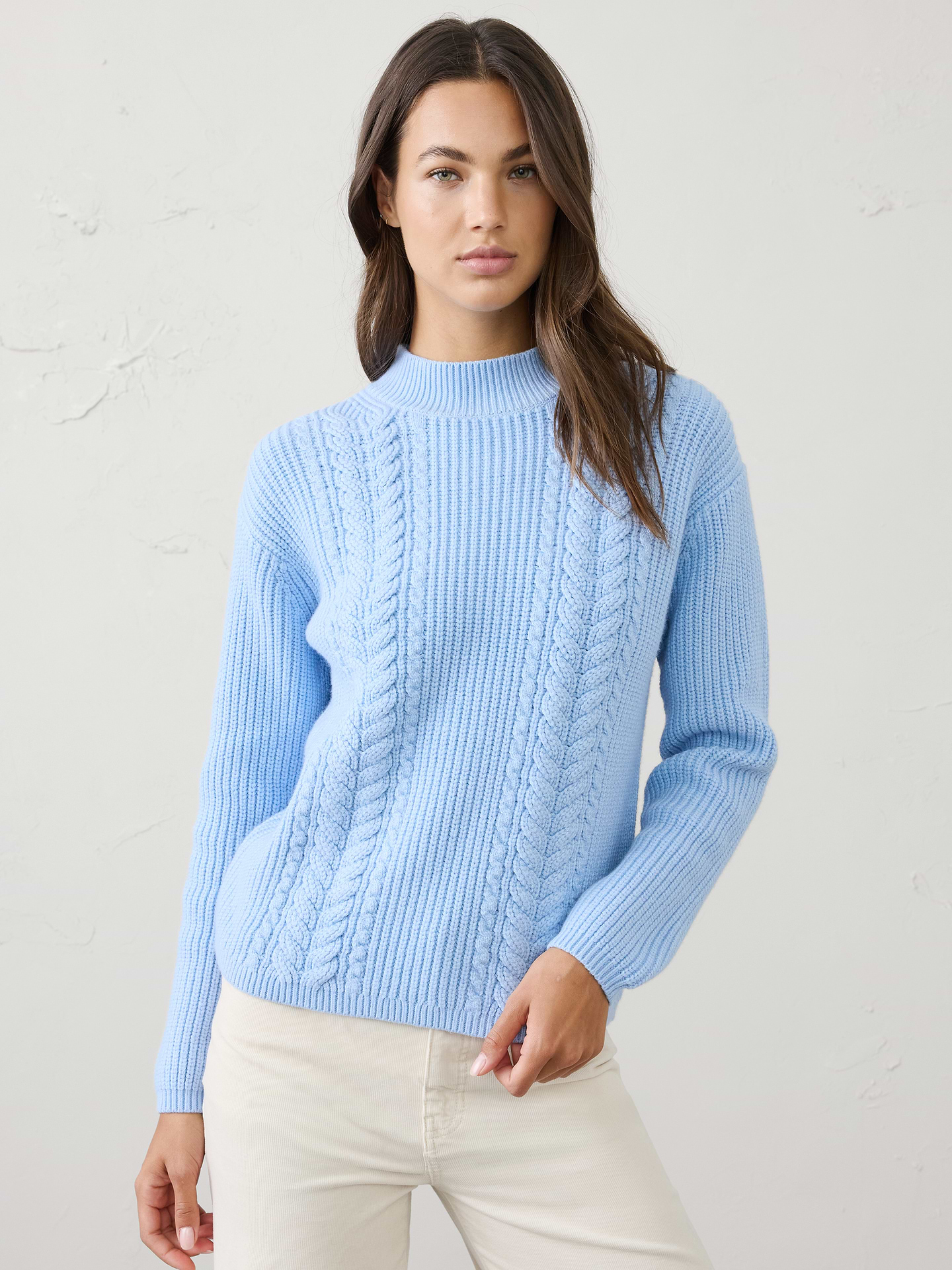 Image 1 of 4, Our sweater is knit from our signature Perfectly Soft yarn—a luxurious blend of cotton with a hint of wool, that feels as cozy as it looks. Classic cable stitching adds timeless texture and dimension, elevating the silhouette with a heritage‑inspired touch., Mock neck. Long sleeves., Drop shoulders., Made exclusively for Banana Republic Factory., Product #1177060
