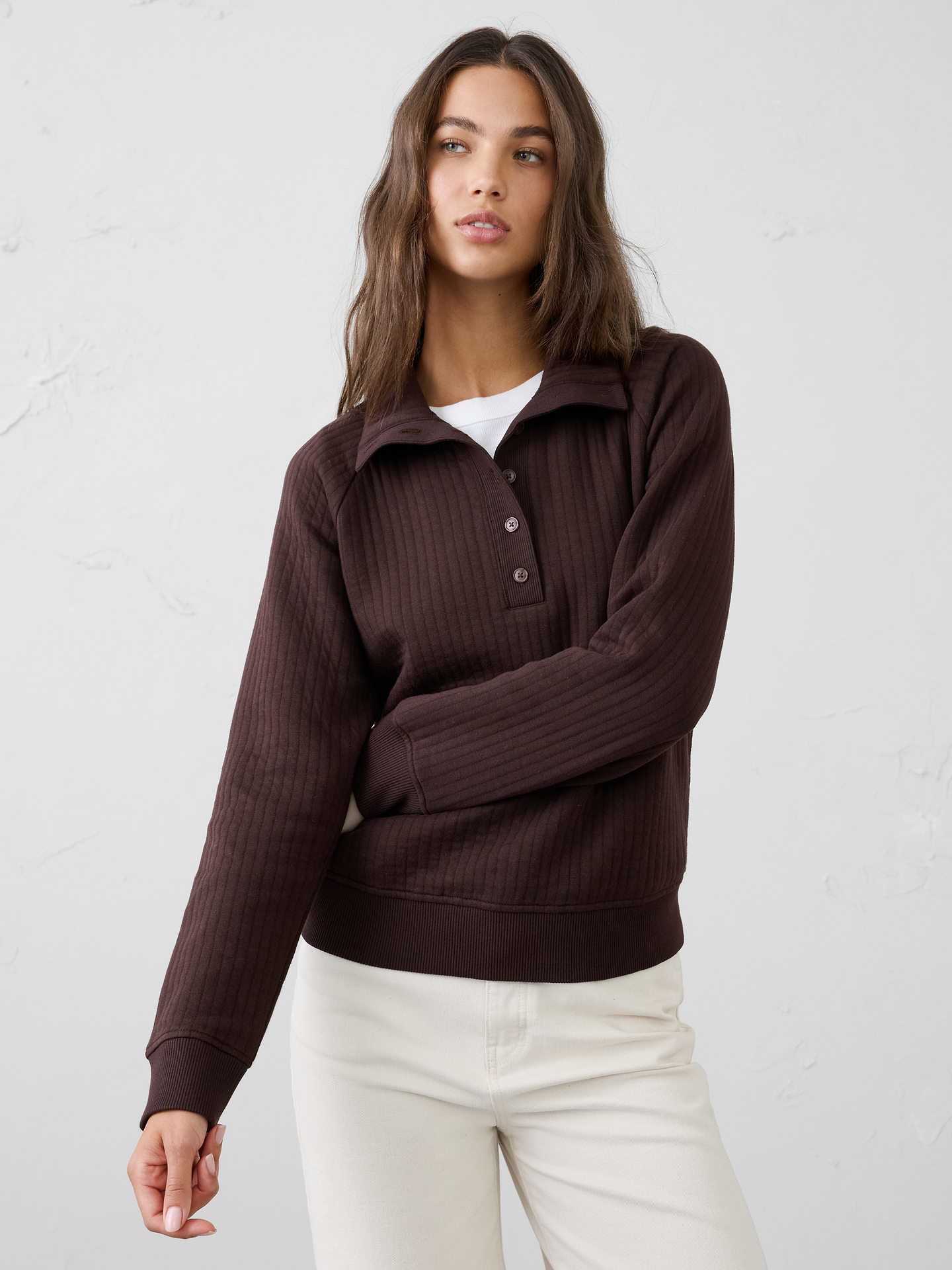 Image 1 of 4, Designed for effortless comfort, this quilted sweatshirt is soft, lightweight, and provides just the right amount of warmth. The textured quilted construction adds subtle dimension and visual interest, while the easy silhouette makes it a versatile layer for everyday wear. Not too heavy and never overcomplicated, it's the kind of comfortable staple you'll reach for again and again., Point collar with extended button henley placket., Long raglan sleeves., Made exclusively for Banana Republic Factory., To view a copy of this product’s label, copy the style number below and search this database Law Label Lookup <, Product #1185994