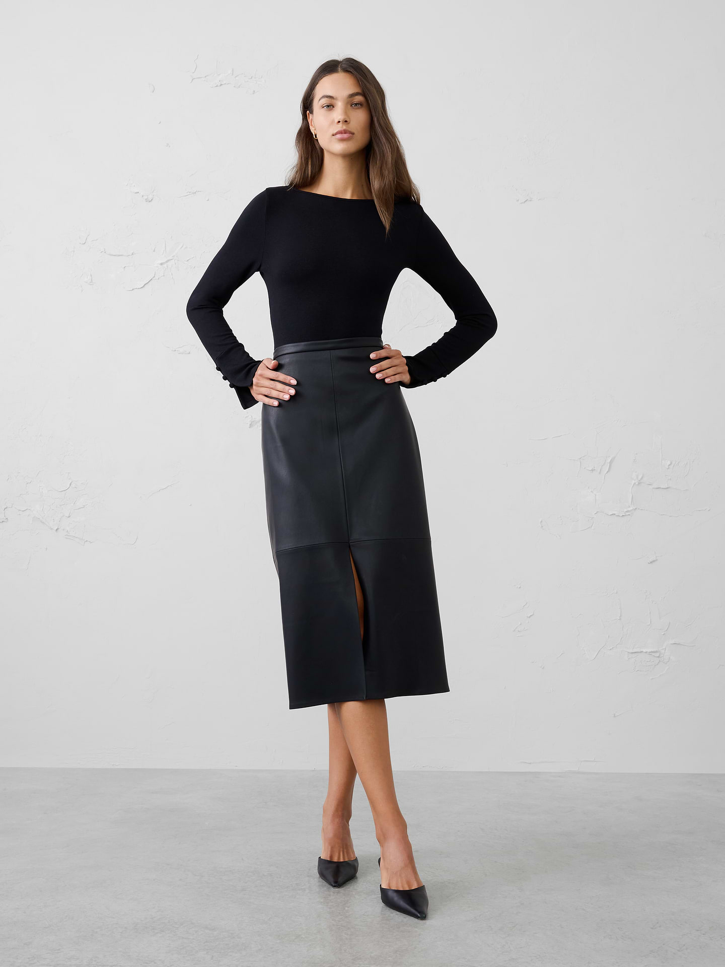 Image 1 of 4, A customer favorite, our Soft Luxe knit returns as a cozy yet lightweight alternative to a traditional sweater. It offers versatile comfort that layers beautifully and transitions effortlessly through the season., Boat neckline. Long sleeves., Decorative button detail accents the lower sleeves., Fitted at the waist., Made exclusively for Banana Republic Factory., Product #1186025