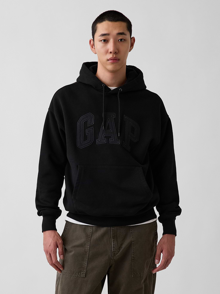 Image 1 of 5, Soft cotton-blend French terry hoodie. In an oversized fit., Hooded neckline with drawcords., Long sleeves with drop shoulders., Gap arch logo at front., Kanga pocket., Banded rib cuffs and hem., Made with 18% recycled polyester. Compared to virgin materials, using recycled materials helps reduce resource use and waste., This product was made in a factory that invests in gender equity and women’s empowerment through RISE. Learn more at gapinc.com/equity ., Product #1184629