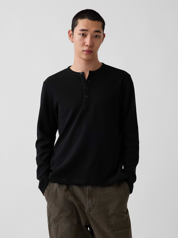Image 1 of 5, Soft, waffle-knit stretch cotton Henley T-shirt., Crewneck with front button placket., Long sleeves., This product was made in a factory that invests in gender equity and women’s empowerment through RISE. Learn more at gapinc.com/equity ., Product #1185662