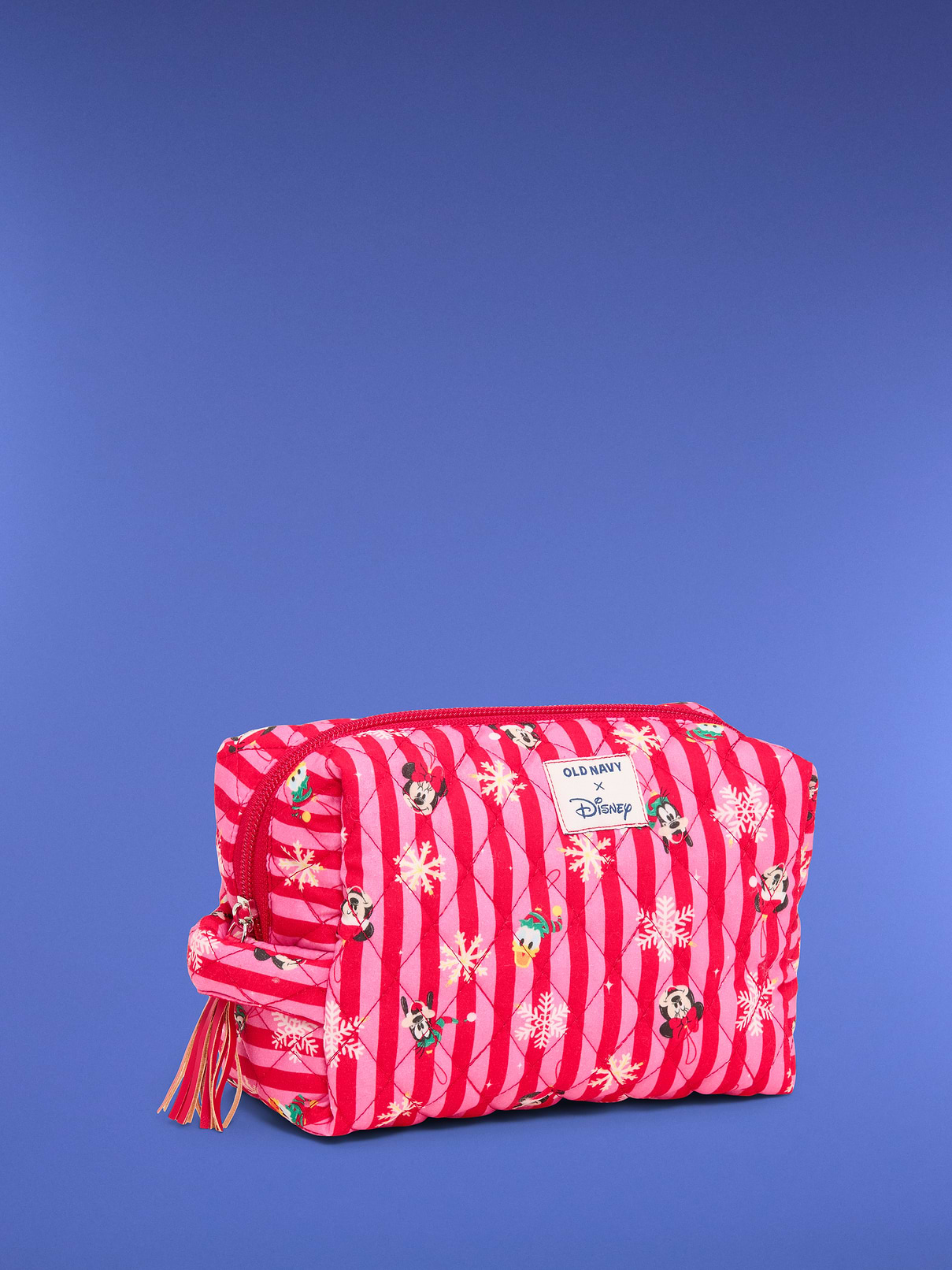 Image 1 of 1, zip-top closure, tassel detail at zipper pull, embroidered patch at front, spacious main compartment, structured rectangular silhouette, licensed graphic, ©Disney, online exclusive, Product #1181930