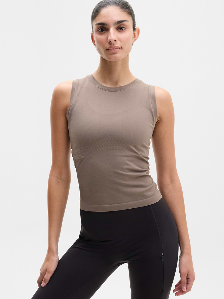 Image 1 of 4, FOR: Medium to high-impact workouts at the gym, studio, or outdoors, FEEL: Enhanced yarns deliver soft stretch and quick recovery, keeping you comfortable while you push your limits, FAVE: The workout top you love, now with upgraded stretch, sweat-wicking power, and sleek style, Seamless construction for minimal chafing, Functional mesh panels allow for optimal movement and breathability, Grippers at inner hem prevent it riding up, Product #845579