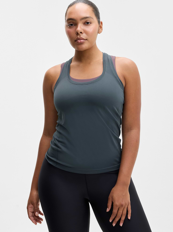 Image 1 of 6, FOR: Medium to high-impact workouts at the gym, studio, or outdoors, FEEL: Enhanced yarns deliver soft stretch and quick recovery, keeping you comfortable while you push your limits, FAVE: The workout top you love, now with upgraded stretch, sweat-wicking power, and sleek style, Seamless construction for minimal chafing, Functional mesh panels allow for optimal movement and breathability, Grippers at inner hem prevent it riding up, Product #845696