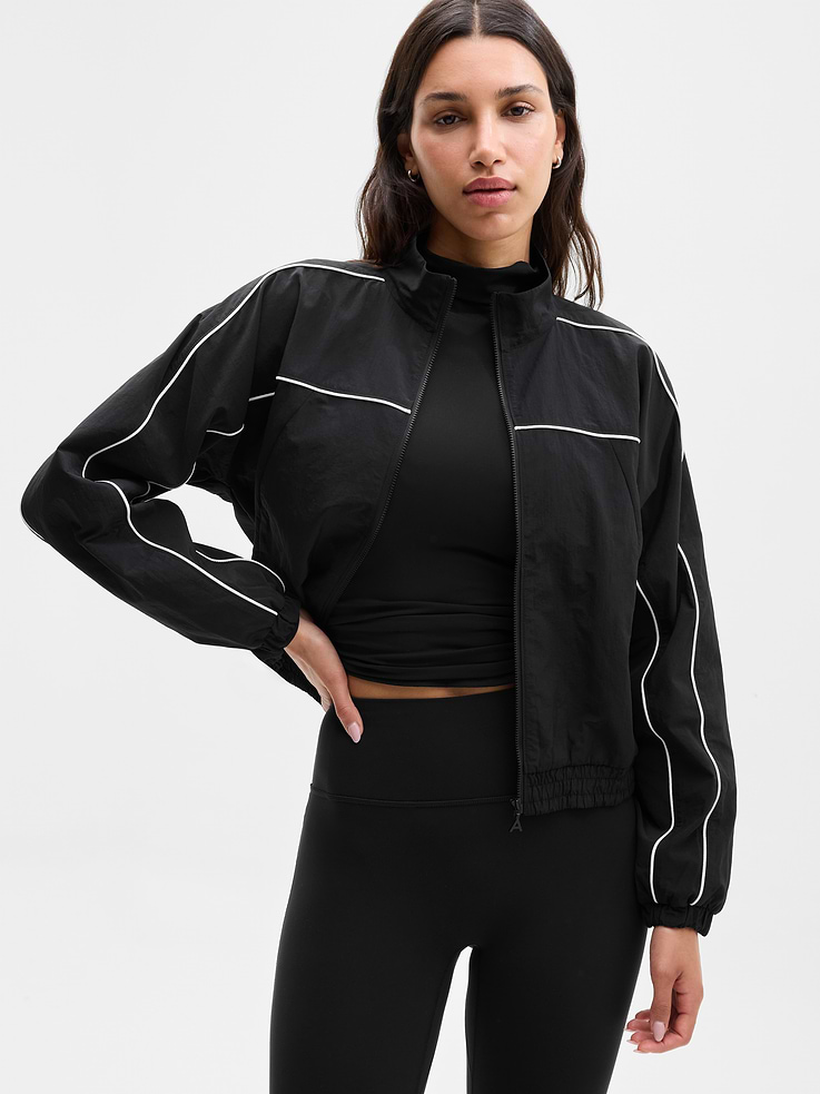 Image 1 of 5, FOR: Commuting, work, and travel, FEEL: Sleek and lightweight with a cool hand-feel, FAVE: Zip pockets secure your essentials, Pair with the On The Move Track Pant for a complete look, Product #844250