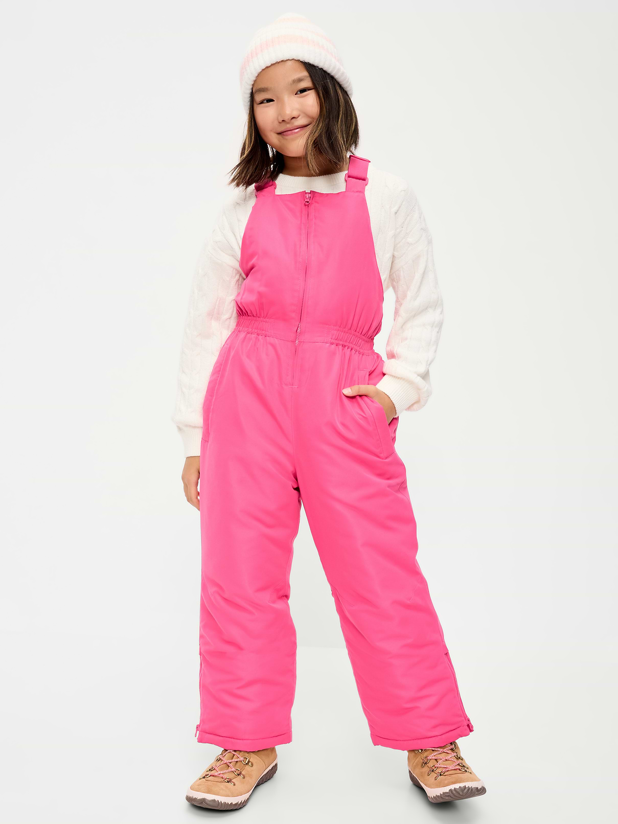 Image 1 of 4, high straight neckline, adjustable elasticized shoulder straps, elasticized waist, diagonal welt zippered pockets in front, single adhesive secure close pocket at back, zippered side panels at ankles, hidden interior storm cuffs, water-resistant, Product #908586
