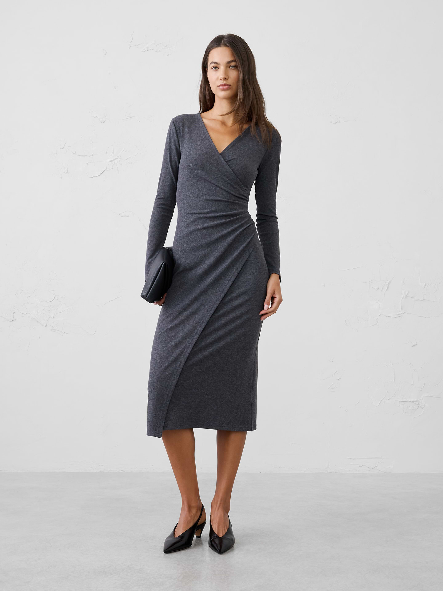 Image 1 of 3, Our customer‑favorite Cozy Rib fabric is reimagined in a flattering fixed‑wrap silhouette that effortlessly defines the waist. Soft, comfortable, and easy to wear, this long midi dress offers an elegant drape and polished look with the cozy feel you love., SUSTAINABILITY: Made with 60% recycled polyester., V-neckline. Long sleeves., Wrap‑inspired front panel., Side ruching gathers at the waist for flattering shape and dimension., Asymmetrical front overlay below the waist., Made exclusively for Banana Republic Factory., Product #1185679