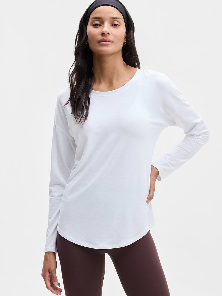 Image 1 of 6, FOR: Yoga or studio practice, FEEL: Soft, premium-weight comfort with luxurious TENCEL™ fibers that drape beautifully, FAVE: Your favorite studio top, modernized for more ease. Same premium-weight fabric, now with added front coverage and a minimal, clean back seam., Product #784678