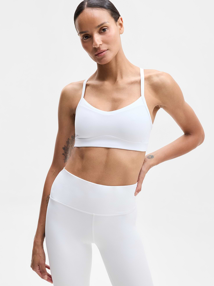 Image 1 of 5, BEST FOR STUDIO: yoga + barre + pilates, IMPACT: Light-impact workouts, best for A-C cups, FEEL: Powervita fabric is buttery soft with support that feels like a gentle hug, FAVE: Sleek racerback design provides distraction-free mobility and airflow, Built-in pockets with removable pads for optional coverage, Removable pads hold their shape from wash to wear, Lined with PowerMesh for breathable, sheer-proof coverage, Product #819515
