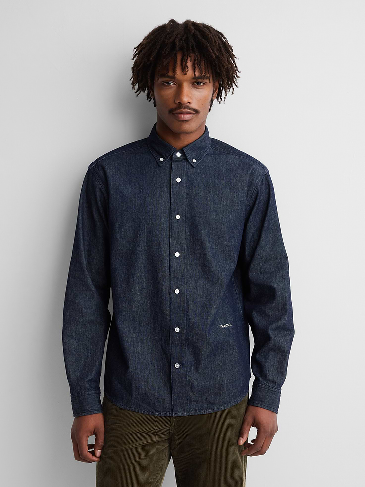Image 1 of 8, Authentic, non-stretch denim shirt. In a relaxed fit., Shirting collar, button front., Long sleeves with button cuffs., Embroidered Gap × A.P.C. logo at front., More Sustainable Cotton: Made with 5% recycled cotton. Compared to virgin materials, using recycled materials helps reduce resource use and waste., Responsibly Made: This shirt is part of our water-saving Washwell program. Compared with conventional wash methods, Washwell uses at least 20% less water., Product #1179790