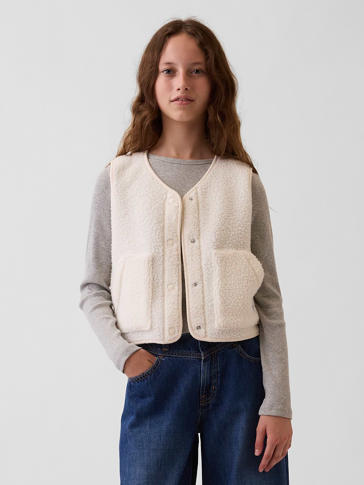 Image 1 of 6, Soft sherpa button-up vest. In a slightly cropped length., V-neck., Sleeveless., Snap button front., Kanga pockets., Product #1181431