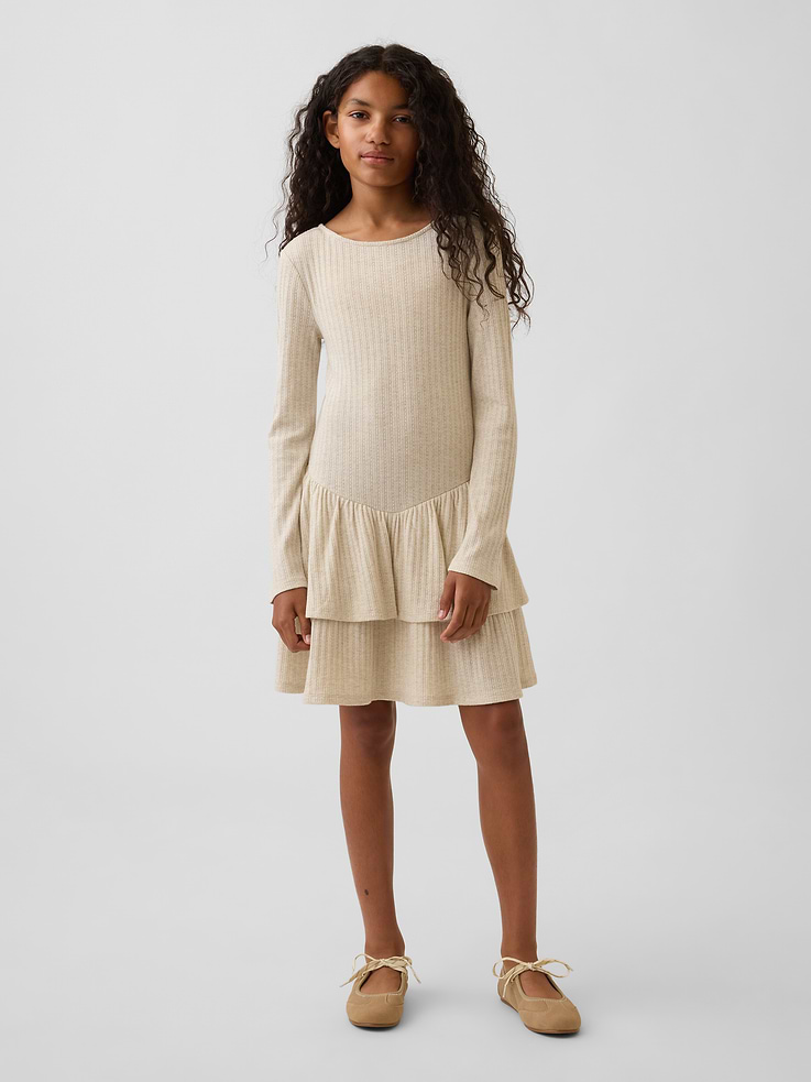 Image 1 of 5, Soft pointelle knit kids dress with metallic detail., Boat neck, scoop back., Long sleeves., Shirring at angled drop waist., Tiered skirt., Product #1181428
