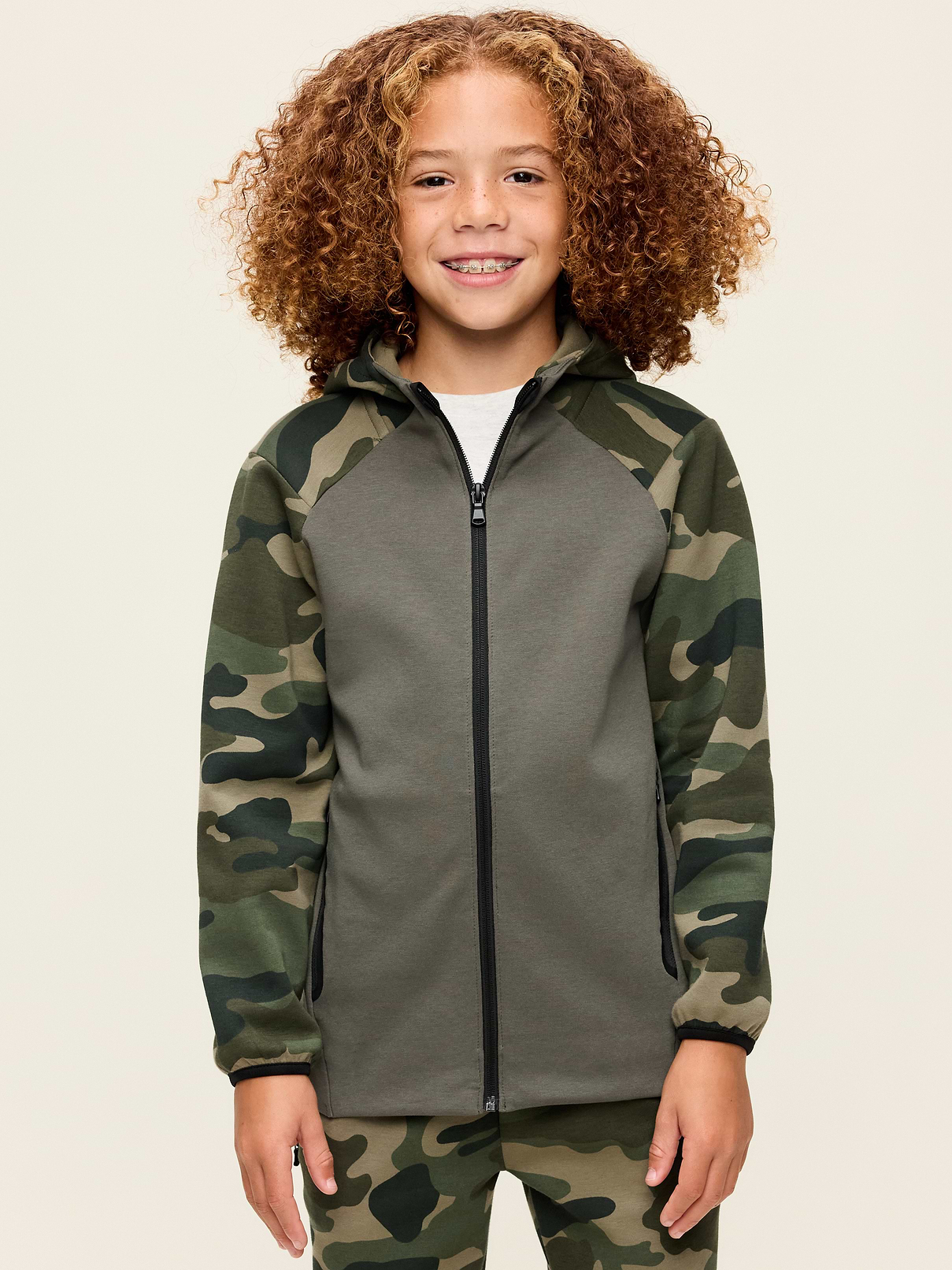 Image 1 of 1, Keep ’em moving in Old Navy Sport's Dynamic Fleece: A soft, breathable cotton blend that's made to move., built-in hood, long sleeves, diagonal zip pockets, full-length zipper, Product #907683