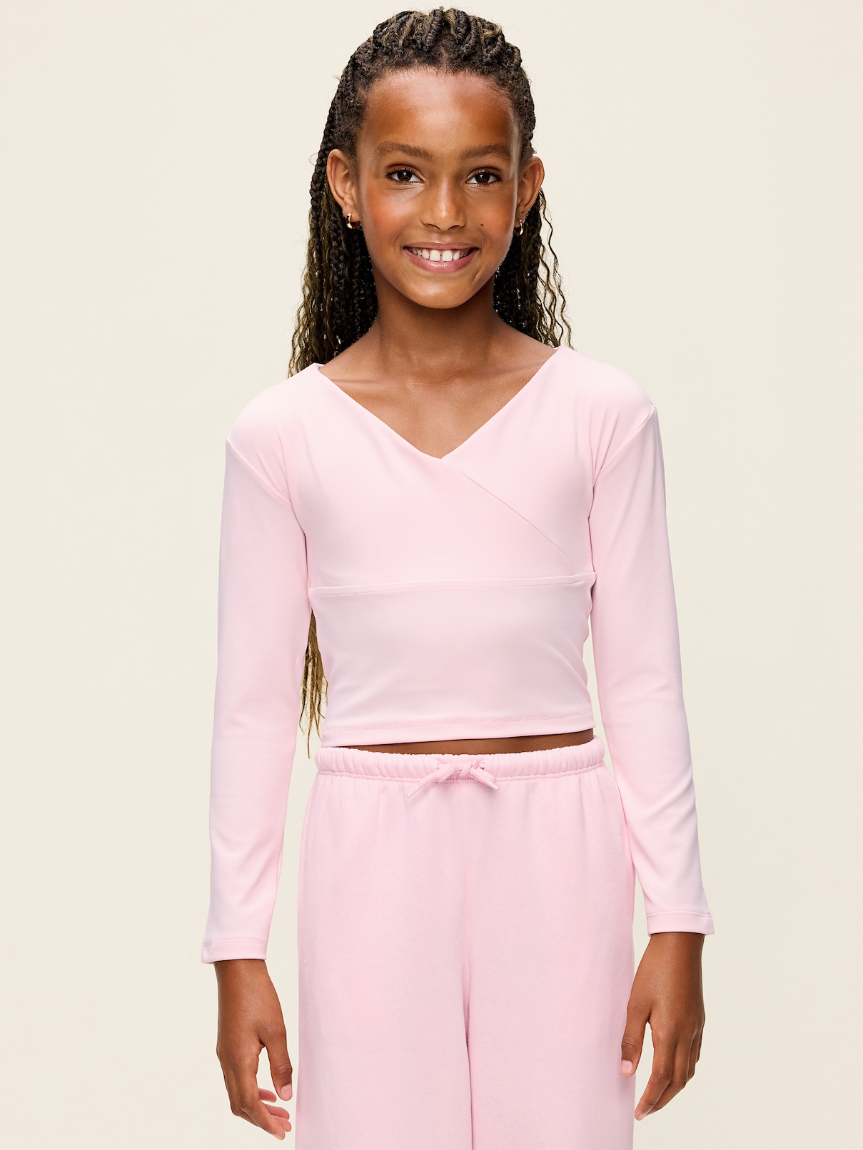 Image 1 of 2, Keep ‘em moving in Old Navy Sport's StudioSmooth: A buttery soft, breathable fabric for all her everyday moves., wrap front, long sleeves, Product #907979