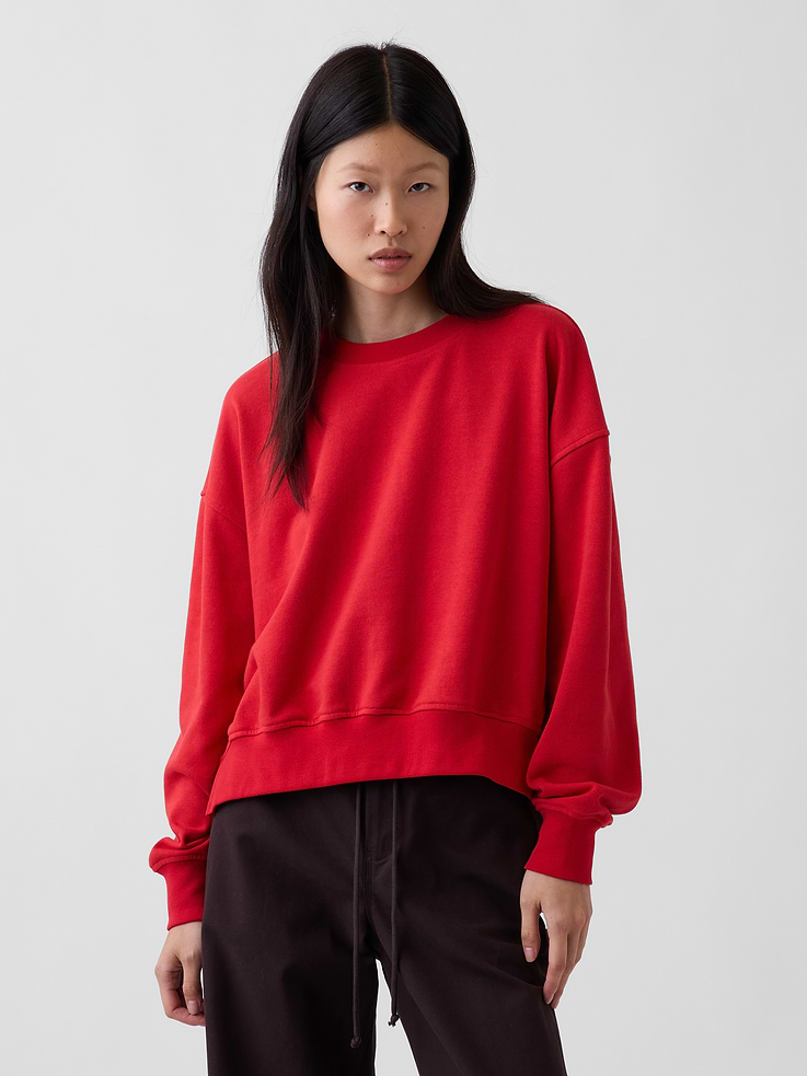 Image 1 of 7, Soft cotton-blend French terry pullover wedge sweatshirt. In an ultra oversized fit and slightly cropped length., Crewneck., Long sleeves with drop shoulders., Banded rib cuffs and hem., Slit at side hems., Made with 23% recycled polyester. Compared to virgin materials, using recycled materials helps reduce resource use and waste., Product #1180261