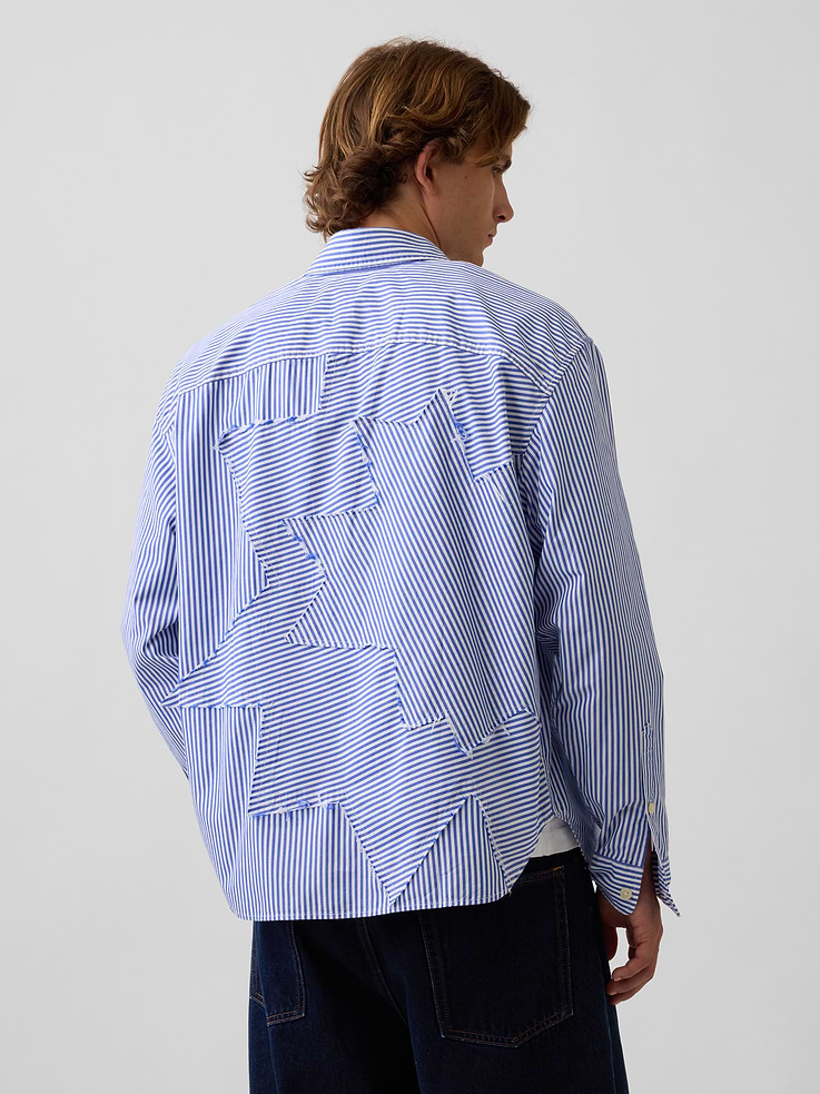Image 1 of 9, Soft poplin cotton shirt. In a relaxed fit., Spread collar, button front., Long sleeves with button cuffs., Patch pocket at chest., Roy Litchenstein's Standing Explosion inspired detailing at back., Allover stripes., Product #1189389
