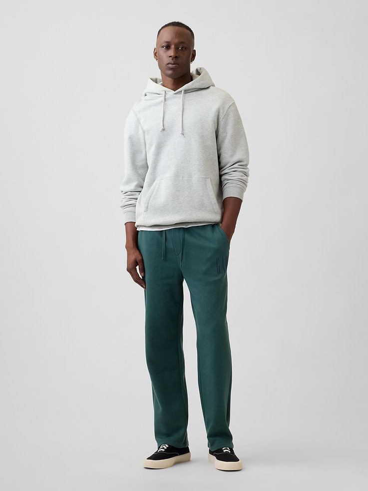 Image 1 of 4, Soft, comfy fleece., Drawcord ties at elasticized waistband., Front slant pockets., Gap logo at leg., This product was made in a factory that invests in gender equity and women’s empowerment through RISE. Learn more at, Product #672980