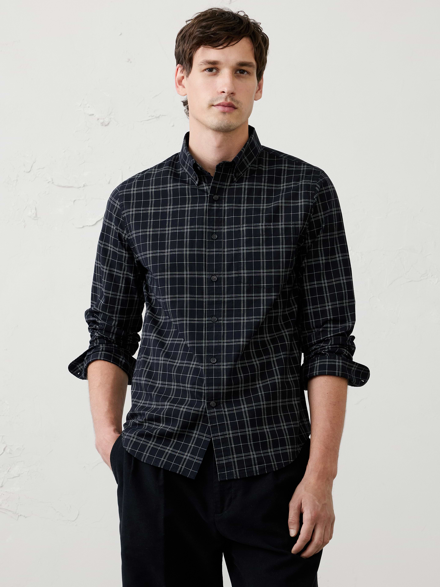 Image 1 of 8, The iconic Softwash Cotton Shirt, is crafted from 100% organic cotton for a soft comfortable feel. Designed in our untucked slim fit with a clean shirttail hem, it's a wardrobe must have-in timeless patterns., MADE WITH ORGANICALLY GROWN COTTON: Made with 100% organic cotton, so it's soft on you and the environment., UNTUCKED FIT: Designed with a shorter hemline to hit right at the hips., Button down collar. Long sleeves with adjustable buttoned cuffs., Chest pocket., Shirttail hem., Made exclusively for Banana Republic Factory., Product #1175894