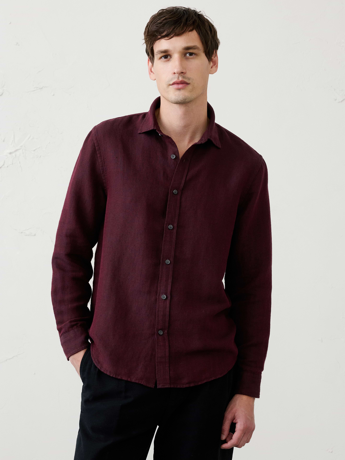 Image 1 of 3, Crafted from breathable linen-cotton blend, this shirt is elevated with a subtle herringbone weave that adds depth and texture. Designed in versatile colors, it delivers effortless warm‑weather style with a refined finish., Point collar. Long sleeves with adjustable double-button barrel cuffs and button vents., Button‑front closure., Back yoke., Shirttail hem., Made exclusively for Banana Republic Factory., Product #1175889