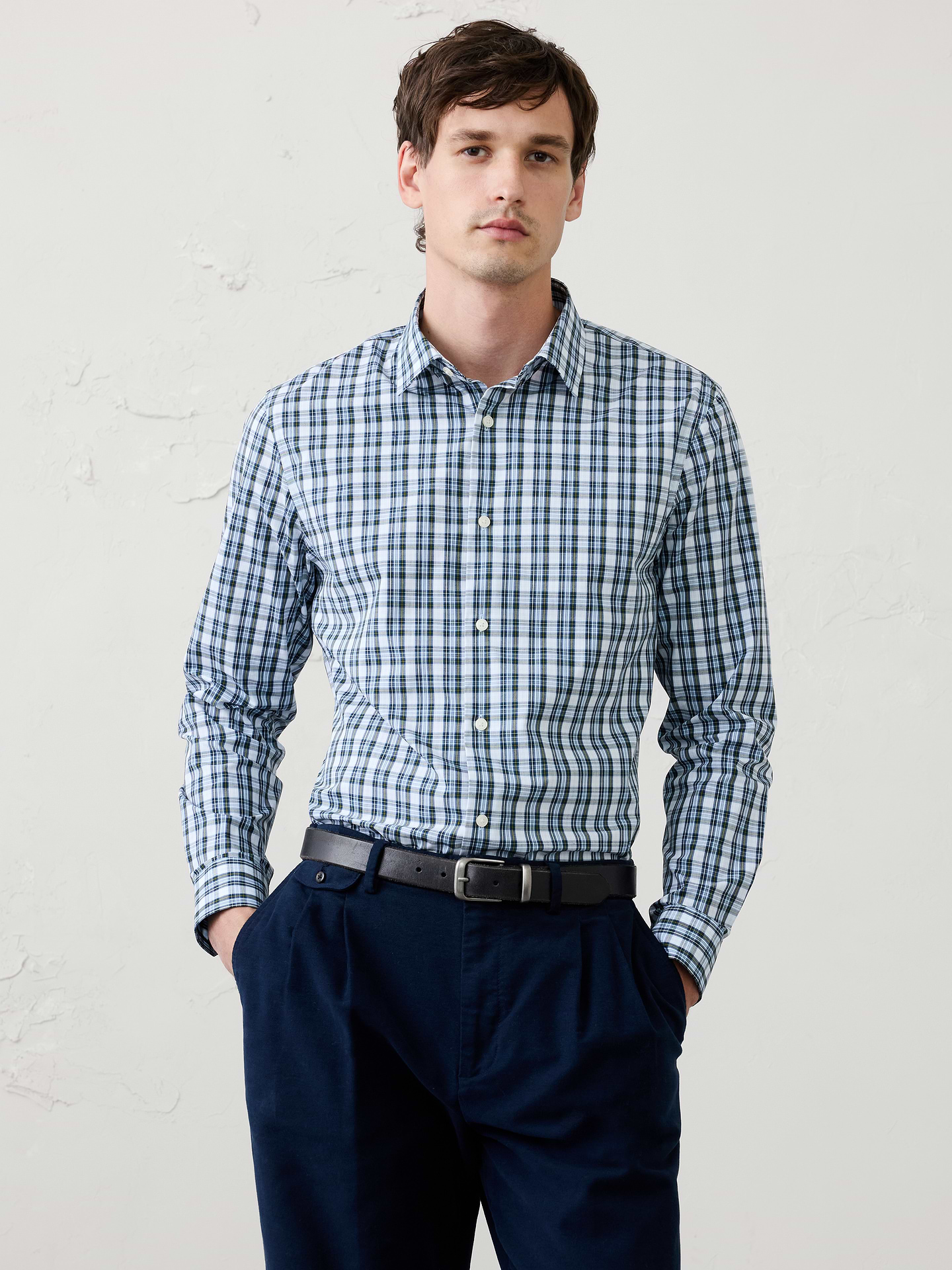 Image 1 of 8, WRINKLE RESISTANT: No need to iron, these soft, cotton dress shirts are specially engineered to resist wrinkles so it stays looking crisp and pulled-together., Spread collar. Long sleeves with adjustable double-button barrel cuffs and button vents., Clean front., Shirttail hem., Made exclusively for Banana Republic Factory., Product #1175946