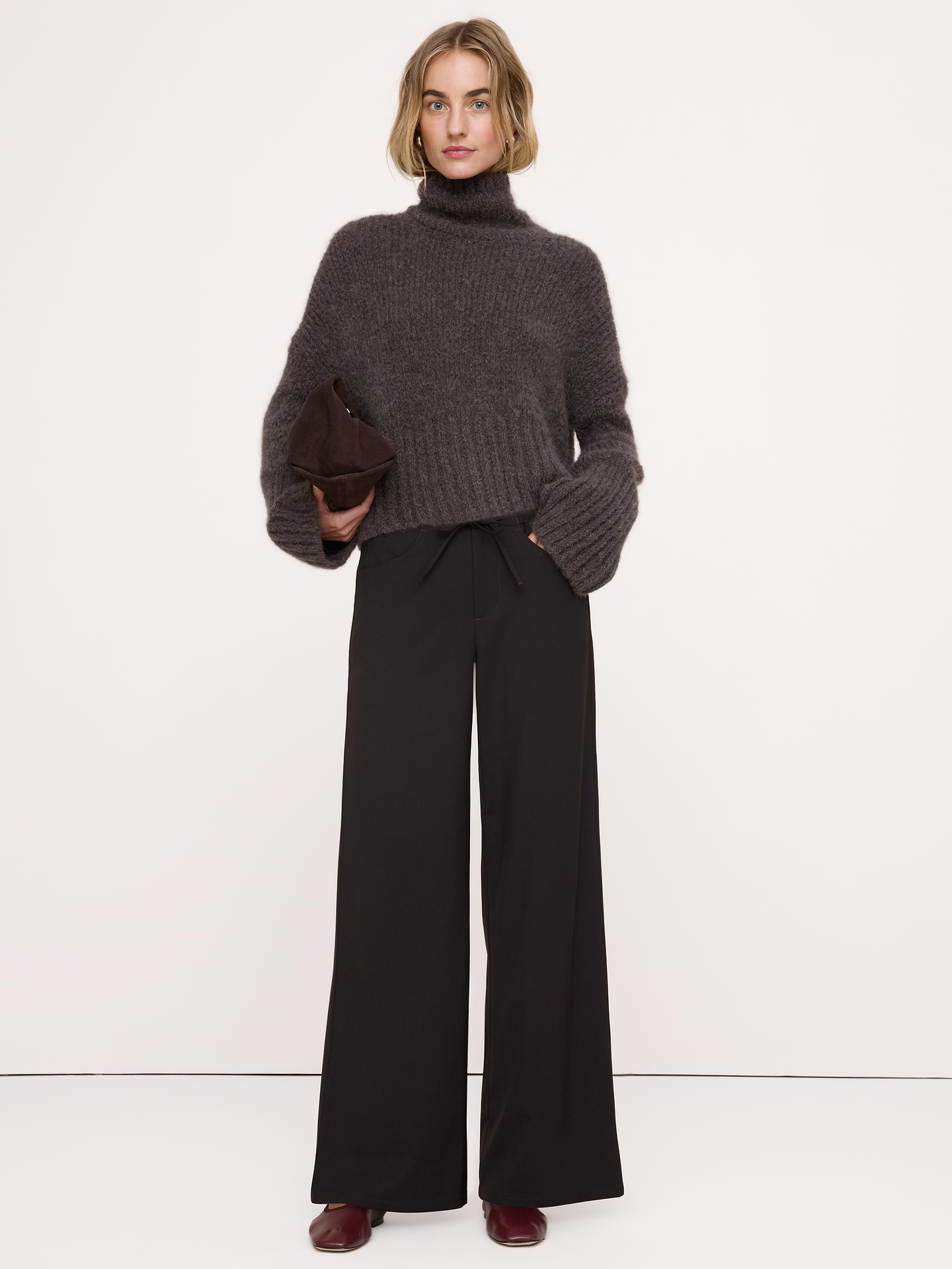 Image 1 of 7, Reach for these pants when you need to strike a balance between sharp tailoring and all-day comfort. We cut them from Italian wool with a touch of stretch for comfort.. Plus, we added elastic at the waist for a custom fit., Wide leg fit: Mid-rise with a straight fit through the thigh and wide leg. Full length., Fabric from Italy's Marzotto mill., Zip fly with button closure. Drawstring waist., Front and back pockets., Unlined., Product #1188384
