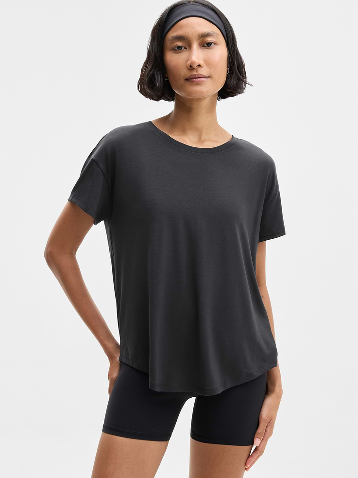 Image 1 of 6, FOR: Yoga or studio practice, FEEL: Soft, premium-weight comfort with luxurious TENCEL™ fibers that drape beautifully, FAVE: Your favorite studio top, modernized for more ease. Same premium-weight fabric, now with added front coverage and a minimal, clean back seam., Product #784677