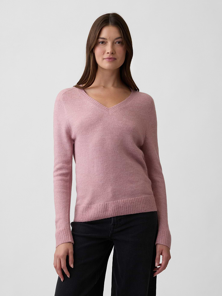 Image 1 of 5, This product is made with/contains 22% recycled polyester. Compared to virgin materials, using recycled materials helps reduce resource use and waste., Soft, lightweight knit., Dropped shoulder, long sleeves with ribbed cuffs., Ribbed V-neck., Ribbed hem., This product was made in a factory that invests in gender equity and women’s empowerment through RISE. Learn more at, Product #1177185