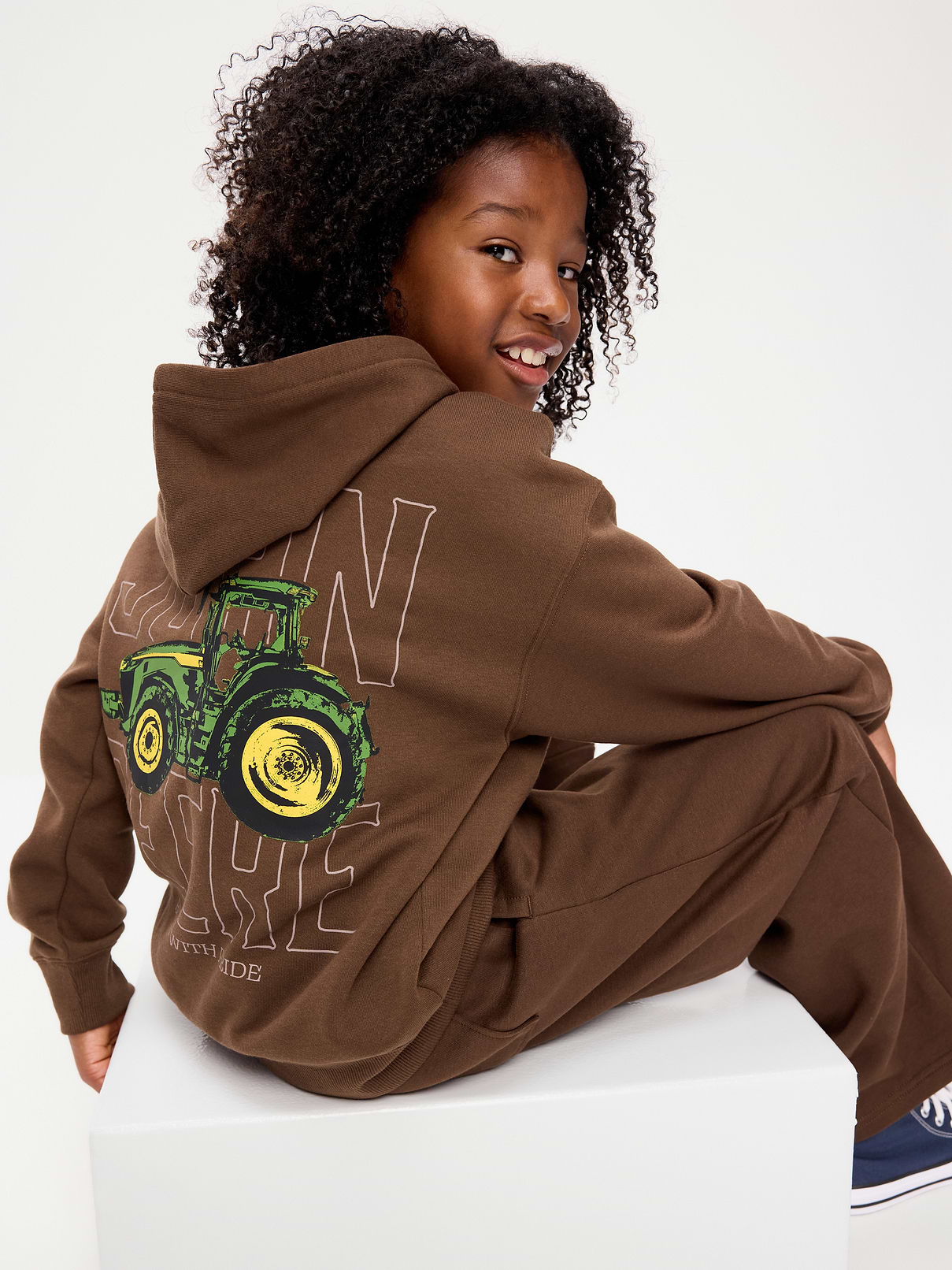 Image 1 of 1, built-in hood, long sleeves, drop shoulders, kangaroo pocket, licensed graphic at front and back, Copyright © 2026 Deere & Company. All Rights Reserved., Product #906066