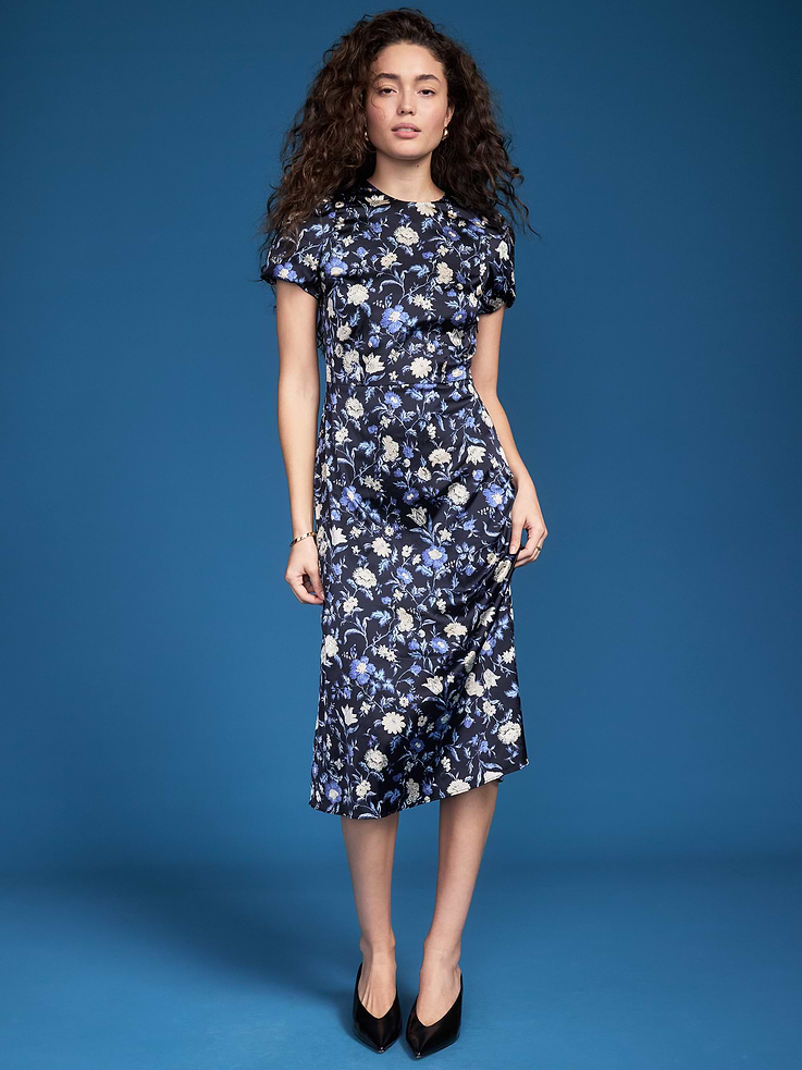 Image 1 of 8, round neckline, short puffy sleeves, shoulder pads, keyhole cutout at center back, seamed waist, full skirt with ruffle trim, concealed side zipper at waist, Product #1193868