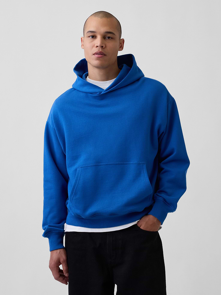 Image 1 of 5, Soft, heavyweight cotton-blend fleece pullover hoodie., Hooded neckline., Long sleeves with banded cuffs., Kanga pocket., Banded hem., This hoodie is made with 14% recycled polyester. Compared to virgin materials, using recycled materials helps to reduce resource use and waste., Explore our GapSweats Guide ., This product was made in a factory that invests in gender equity and women’s empowerment through RISE. Learn more at gapinc.com/equity ., Product #821270