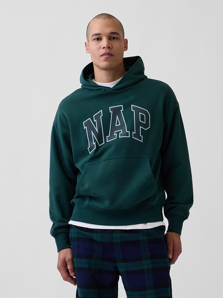 Image 1 of 5, Our softer than soft sweats. Brushed on the inside. Smooth on the outside. Made so that no two are alike., Soft cotton-blend fleece pullover hoodie. In an oversized fit., Hooded neckline.Long sleeves with drop shoulders., NAP arch logo at front., Kanga pocket., Banded cuffs & hem., Made with 23% recycled polyester. Compared to virgin materials, using recycled materials helps reduce resource use and waste., Explore our GapSweats Guide ., This product was made in a factory that invests in gender equity and women’s empowerment through RISE. Learn more at gapinc.com/equity ., Product #898155