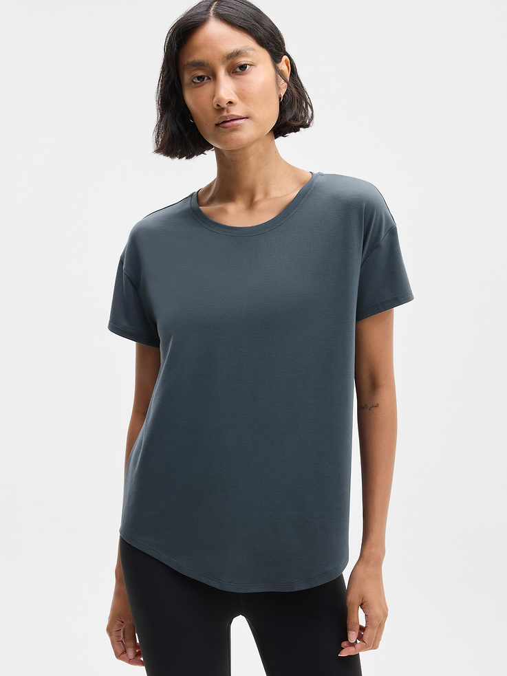 Image 1 of 6, FOR: Yoga or studio practice, FEEL: Soft, premium-weight comfort with luxurious TENCEL™ fibers that drape beautifully, FAVE: Your favorite studio top, modernized for more ease. Same premium-weight fabric, now with added front coverage and a minimal, clean back seam., Product #784677
