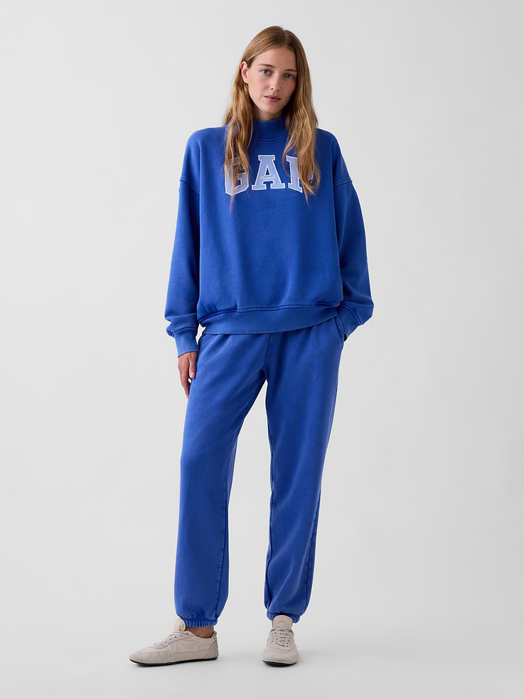 Image 1 of 6, Soft cotton-blend fleece joggers in a relaxed fit., Elasticized waist with inner drawcords., Side on-seam pockets., Elasticized cuffs., Made with 23% recycled polyester. Compared to virgin materials, using recycled materials helps reduce resource use and waste., Explore our GapSweats Guide ., Product #903064
