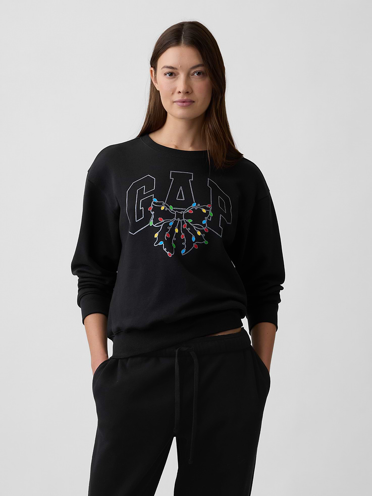 Image 1 of 5, Soft, comfy fleece., Long sleeves with banded cuffs., Crewneck., Gap logo at front., Banded hem., This product was made in a factory that invests in gender equity and women’s empowerment through RISE. Learn more at, Product #1172777