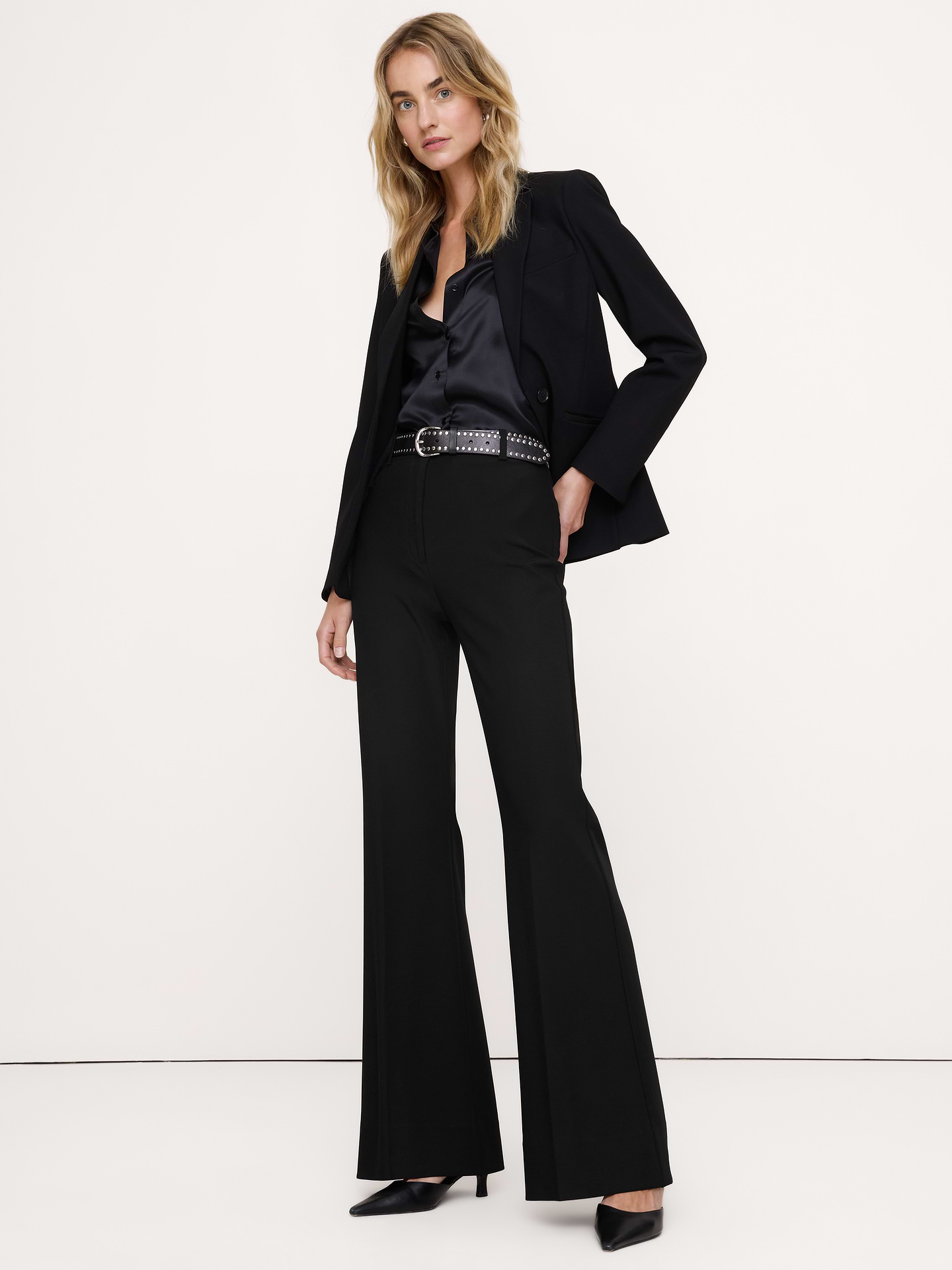 Image 1 of 8, We love when a pant that looks as good as it feels, so we cut this flared pant in our City Stretch fabric—beloved for its softness, high-stretch and dressed-up appearance., High-Rise Flare: High-waisted, Fitted through waist, hip, and thigh with a flared leg. Full length., Zip fly with hook-and-bar closure. Belt loops., Trouser crease., Unlined., Product #853869