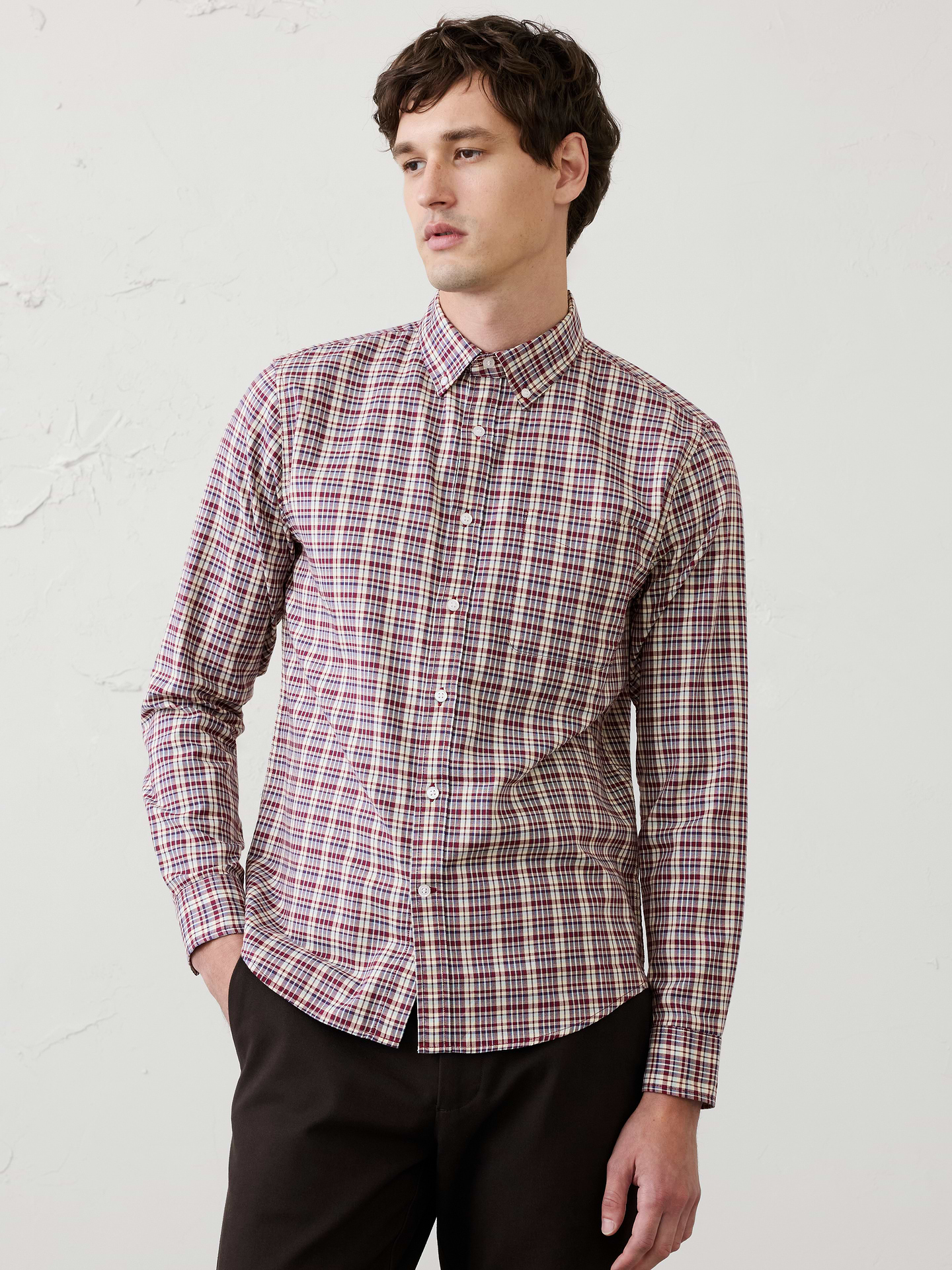 Image 1 of 8, UNTUCKED FIT: Designed with a shorter hemline to hit right at the hips., Button down collar. Long sleeves with adjustable double-button barrel cuffs and button vents., Button front closure., Chest pocket., Shirttail hem., Made exclusively for Banana Republic Factory., Product #884429