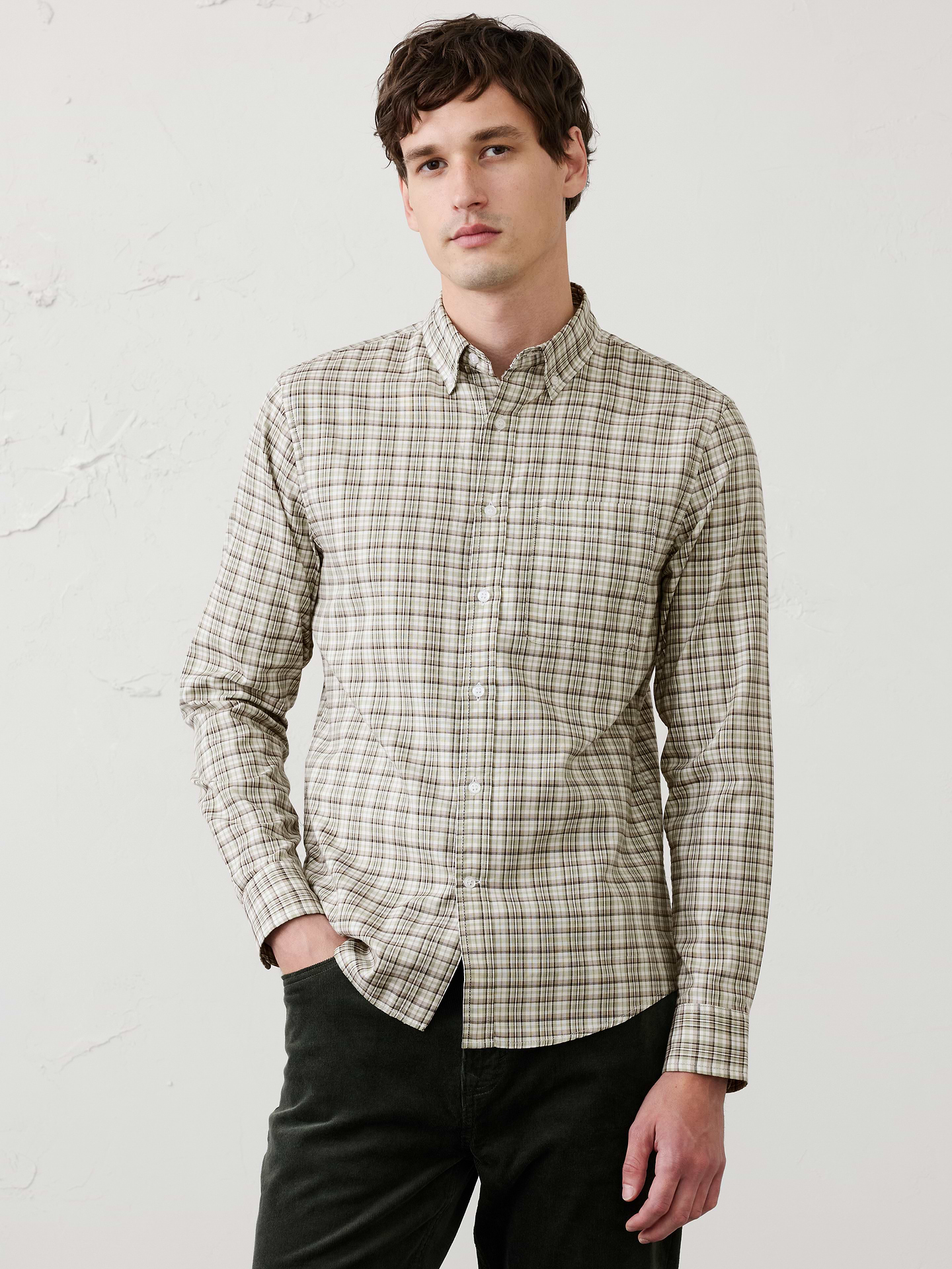 Image 1 of 7, UNTUCKED FIT: Designed with a shorter hemline to hit right at the hips., Button down collar. Long sleeves with adjustable double-button barrel cuffs and button vents., Button front closure., Chest pocket., Shirttail hem., Made exclusively for Banana Republic Factory., Product #884429