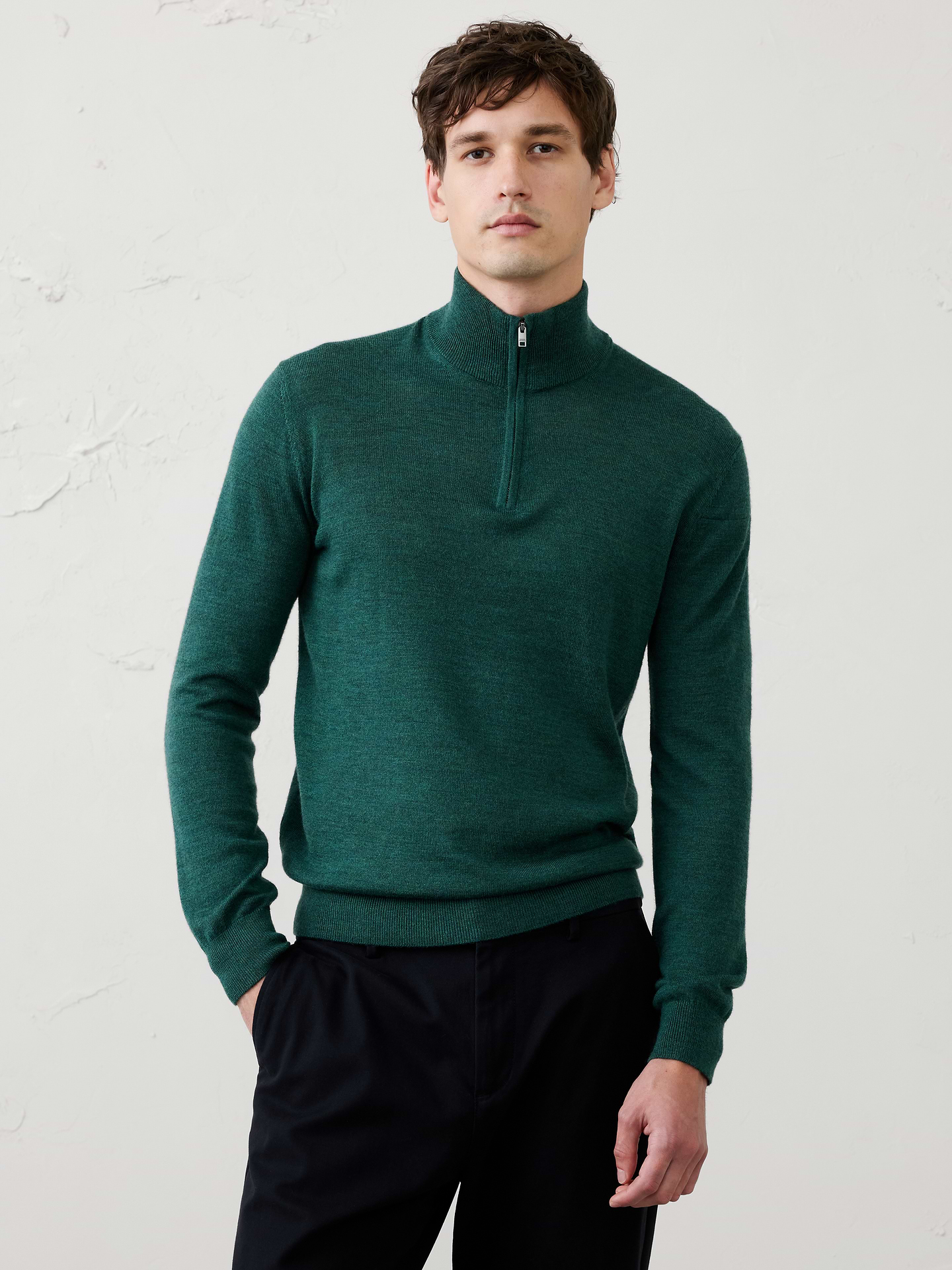 Image 1 of 6, Spun from 100% merino wool, this quarter-zip sweater combines natural temperature regulation with elevated style. The mock-neck silhouette lends a modern touch, while ribbed cuffs and hem provide a comfortable, structured fit., WASHABLE MERINO WOOL: Skip the dry cleaners, this 100% Merino wool sweater is lightweight, comfortable, moisture wicking, odor resistant and machine washable., Mock neck. Long sleeves., Slight dropped shoulders., Ribbed neck, arm cuffs and hem., Straight hem., Made exclusively for Banana Republic Factory., Product #1175513