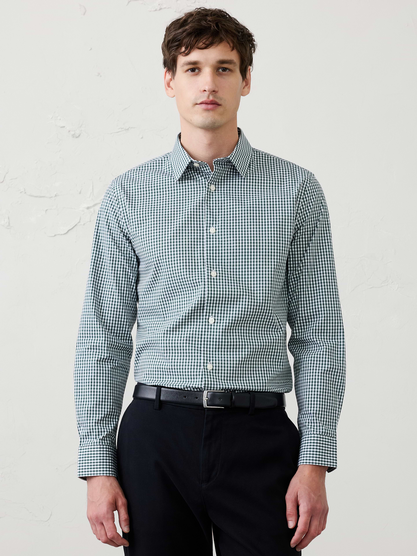 Image 1 of 8, WRINKLE RESISTANT: No need to iron, these soft, cotton dress shirts are specially engineered to resist wrinkles so it stays looking crisp and pulled-together., Spread collar. Long sleeves with adjustable double-button barrel cuffs and button vents., Clean front., Shirttail hem., Made exclusively for Banana Republic Factory., Product #1175946