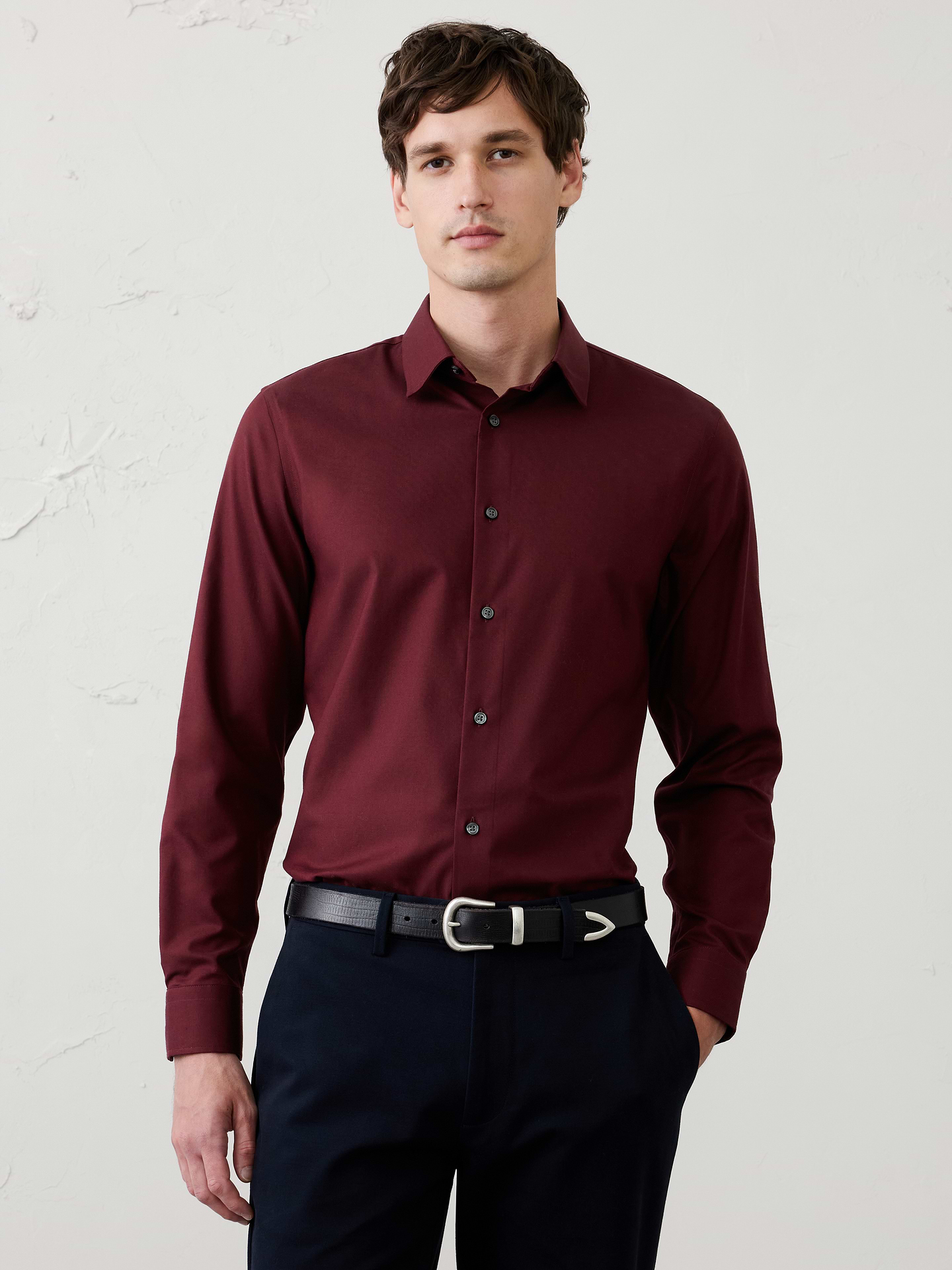 Image 1 of 8, WRINKLE RESISTANT: No need to iron, these soft, cotton dress shirts are specially engineered to resist wrinkles so it stays looking crisp and pulled-together., Spread collar. Long sleeves with adjustable double-button barrel cuffs and button vents., Clean front., Shirttail hem., Made exclusively for Banana Republic Factory., Product #1175946