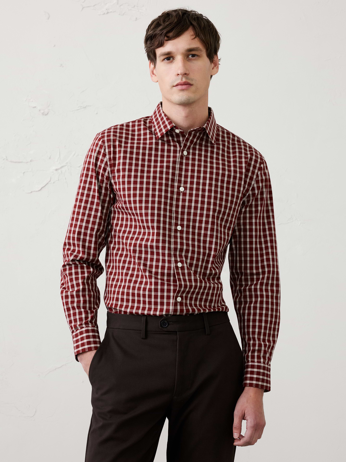 Image 1 of 8, WRINKLE RESISTANT: No need to iron, these soft, cotton dress shirts are specially engineered to resist wrinkles so it stays looking crisp and pulled-together., Spread collar. Long sleeves with adjustable double-button barrel cuffs and button vents., Clean front., Shirttail hem., Made exclusively for Banana Republic Factory., Product #1175946