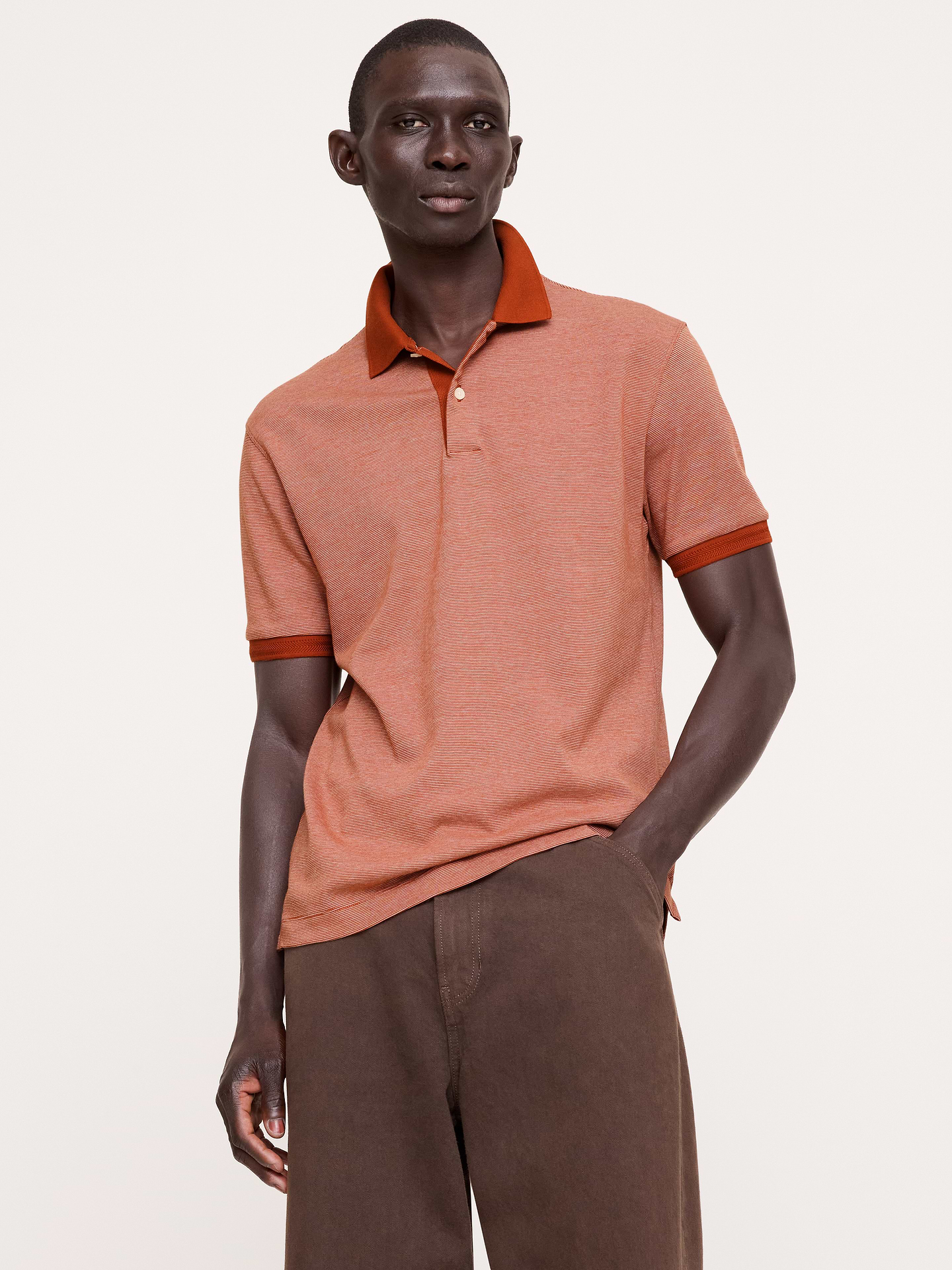 Image 1 of 8, Our tried-and-true Luxury Touch polo—beloved for its signature softness and dressed-up appearance., Standard Fit: A straight and easy fit., Polo collar., Button placket., Straight hem with vented sides., Product #811423