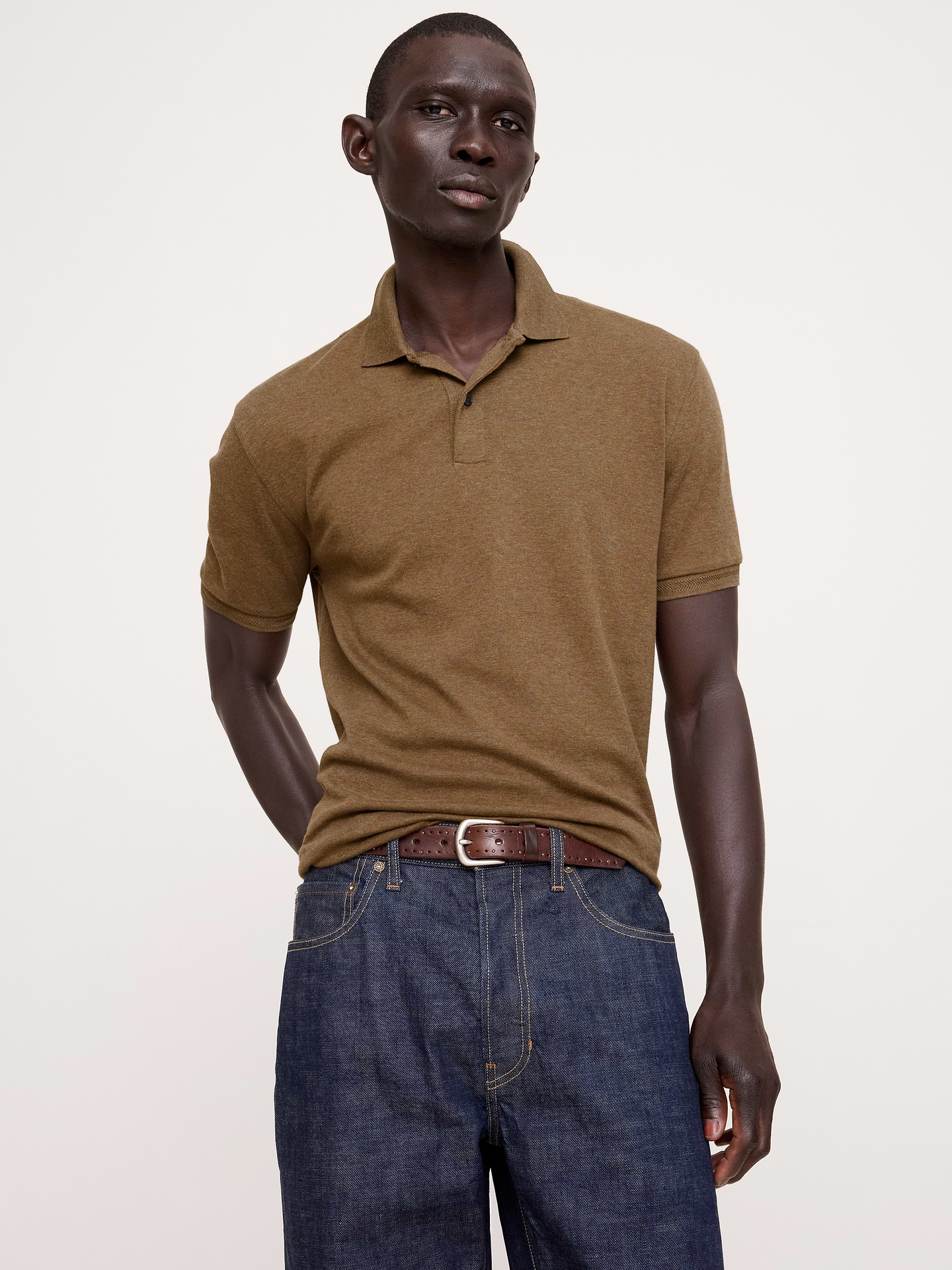Image 1 of 8, Our tried-and-true Luxury Touch polo—beloved for its signature softness and dressed-up appearance., Standard Fit: A straight and easy fit., Polo collar., Button placket., Straight hem with vented sides., Product #811423