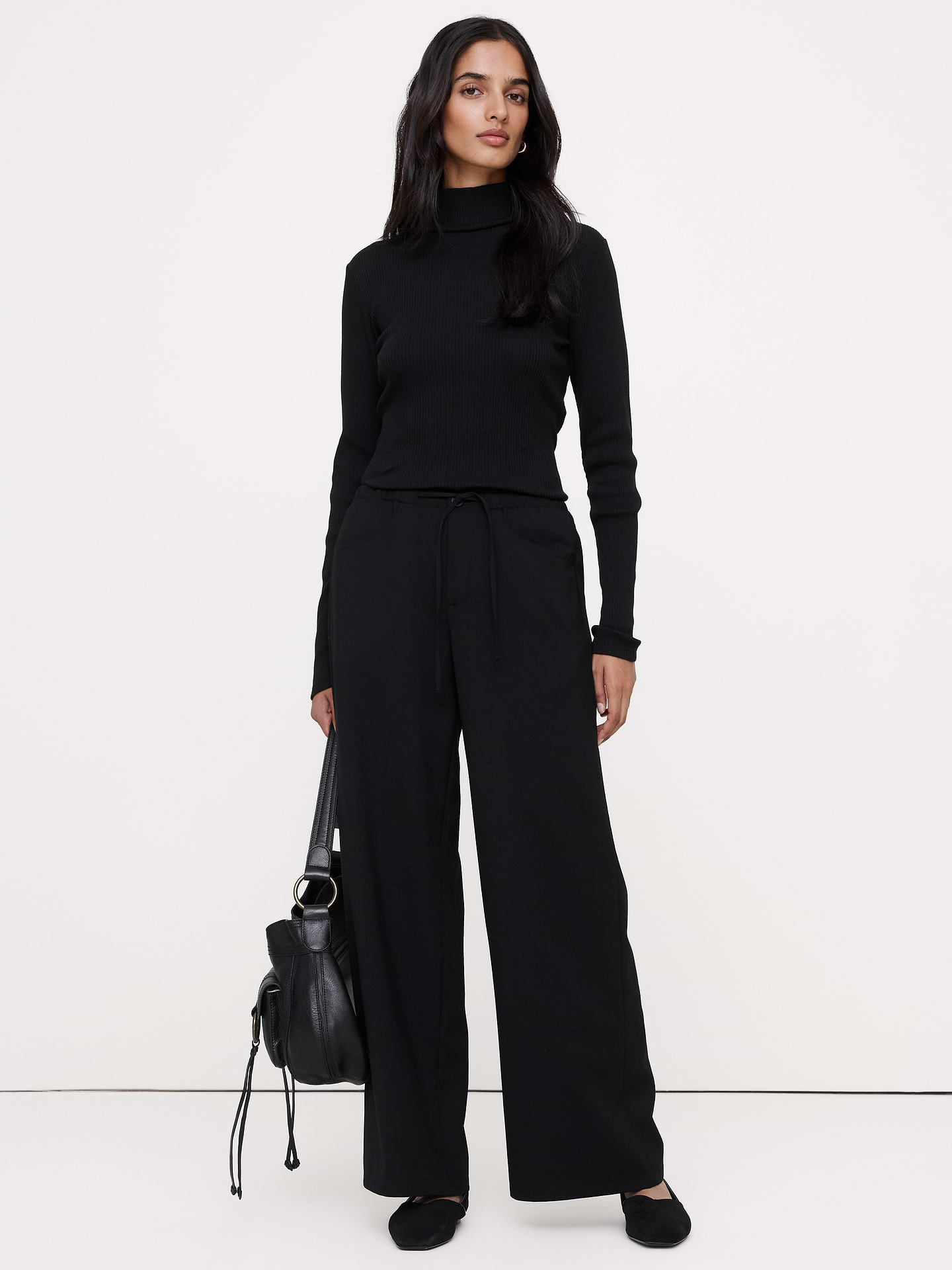 Image 1 of 8, Reach for these pants when you need to strike a balance between sharp tailoring and all-day comfort. We cut them from Italian wool with a touch of stretch for comfort.. Plus, we added elastic at the waist for a custom fit., Wide leg fit: Mid-rise with a straight fit through the thigh and wide leg. Full length., Fabric from Italy's Marzotto mill., Zip fly with button closure. Drawstring waist., Front and back pockets., Unlined., Product #1188384