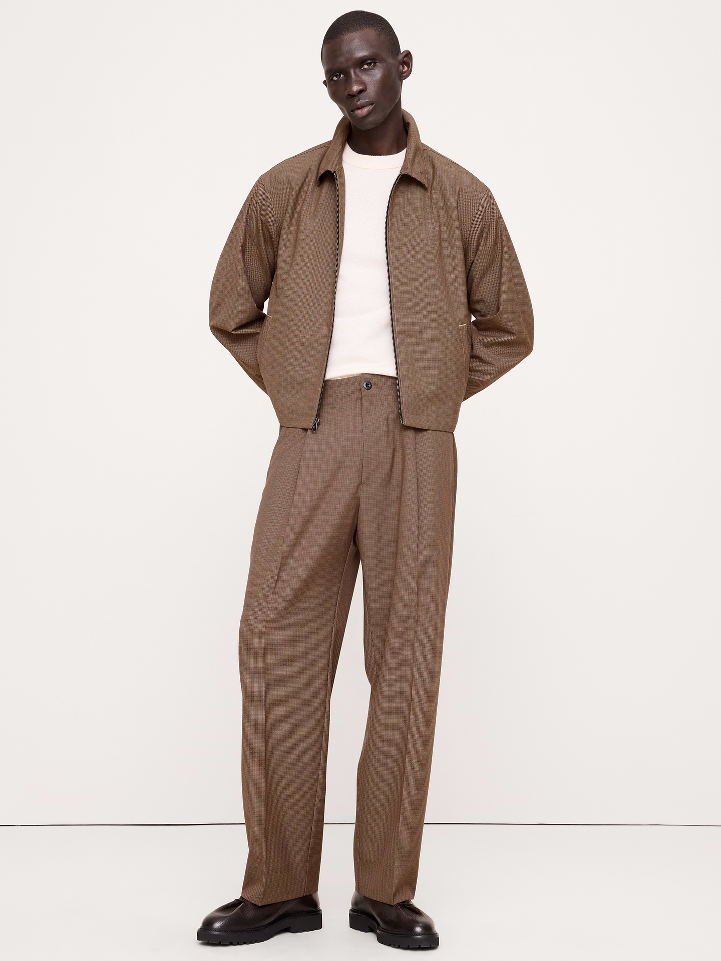 Image 1 of 1, Your passport's favorite pant. We made this pleated pair with an elastic waist for comfort and a fully functional fly that leans more dressed up. Softly tailored for ease and movement, with a lightweight fabric that makes it perfect for layering. Wrinkle-Resistant, Relaxed Fit: Mid rise. Relaxed fit through hip, thigh and a relaxed leg., Zip fly with button closure. Belt loops., Elastic waist with internal drawstring closure., Front and back pockets., Unlined., Product #1182602