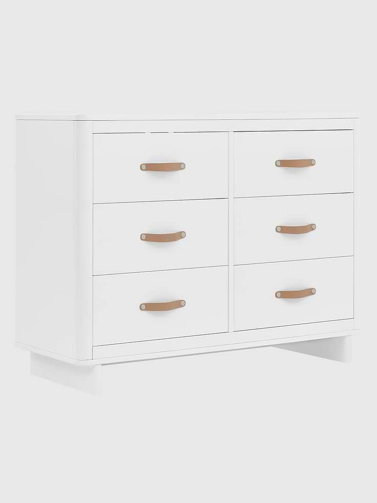 Image 1 of 5, Everyday luxury that’s easy, the Skye Dresser features six large drawers with leather handles and modern feet., For your child’s safety, this dresser is outfitted with an interlocking drawer system that limits the number of drawers that can be opened at one time., This dresser is Greenguard Gold certified to meet the most stringent chemical emissions standards., Easily mix, match, and layer with other items from the babyGap Furniture Collection., Pair with the coordinating Changing Top to convert the dresser into a convenient changing table (Changing Top and changing pad sold separately)., This dresser is tested to meet the current requirements of ASTM F2057, the mandatory CPSC safety standard that protects children from tip-over incidents., For additional security, we strongly recommend that all dressers in your home be anchored; all babyGap dressers include a wall anchor., Durable and easy to clean finish; wipe with damp cloth and dry immediately.
