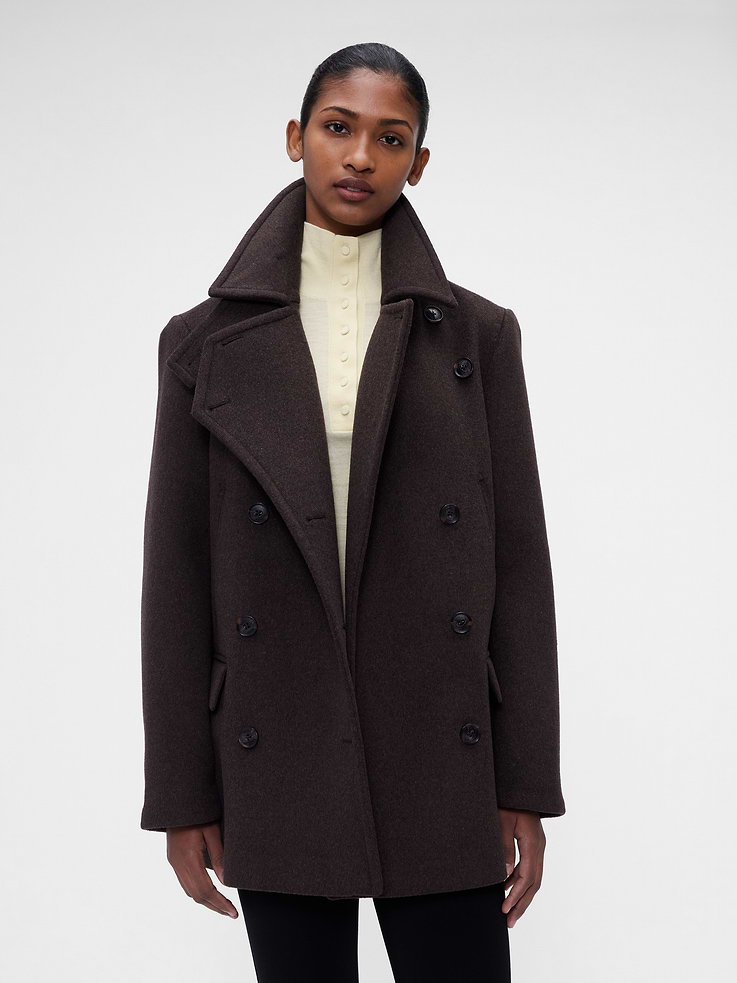 Image 1 of 10, Wool-blend peacoat. In an oversized fit., Notch lapels., Long sleeves., Double-breasted, logo button front., Flap welt pockets., Made with 50% recycled wool, 40% recycled polyester. Compared to virgin materials, using recycled materials helps reduce resource use and waste., Product #1183580