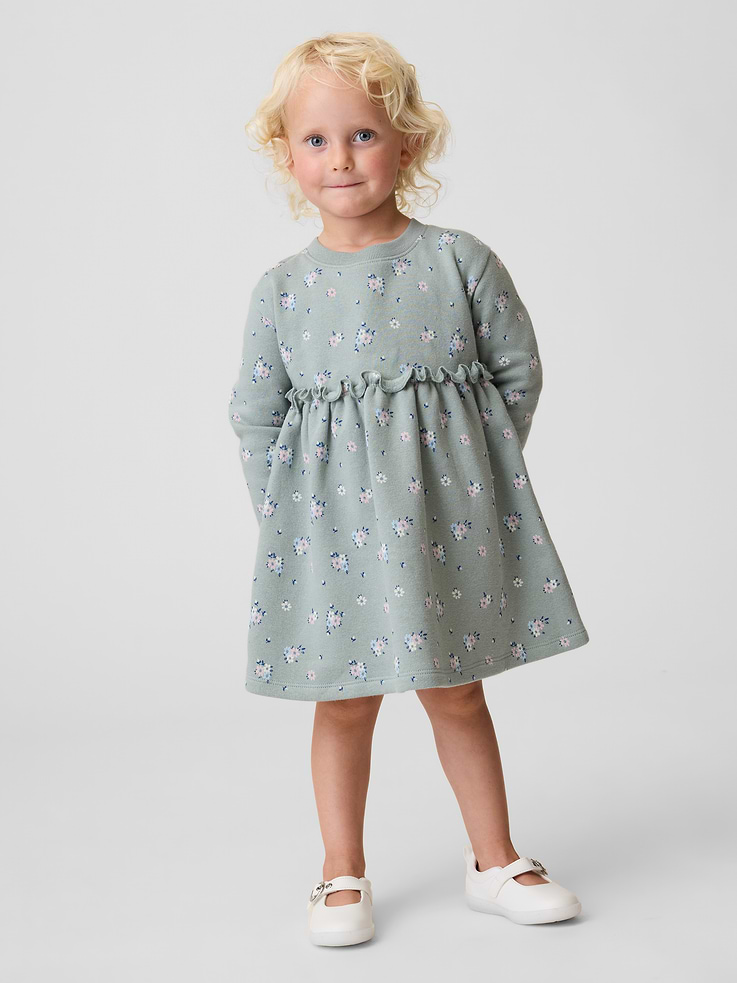 Image 1 of 3, Soft cotton-blend fleece dress., Crewneck., Long sleeves with drop shoulders., Shirring at waist seam., Made with 21% recycled polyester. Compared to virgin materials, using recycled materials helps reduce resource use and waste., Product #912110