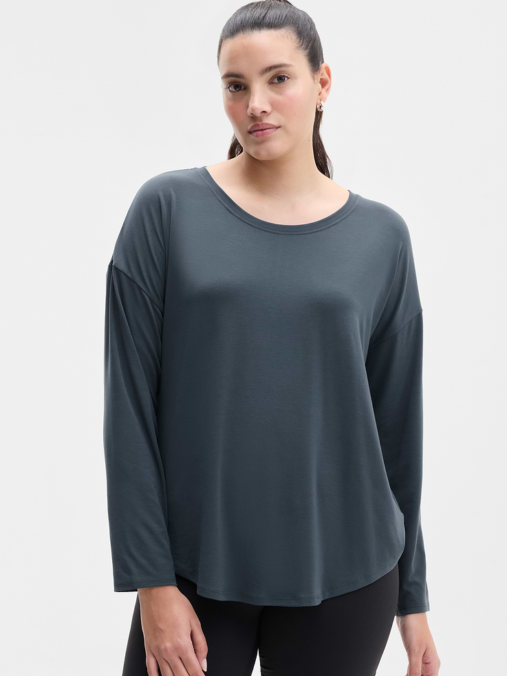 Image 1 of 6, FOR: Yoga or studio practice, FEEL: Soft, premium-weight comfort with luxurious TENCEL™ fibers that drape beautifully, FAVE: Your favorite studio top, modernized for more ease. Same premium-weight fabric, now with added front coverage and a minimal, clean back seam., Product #784678