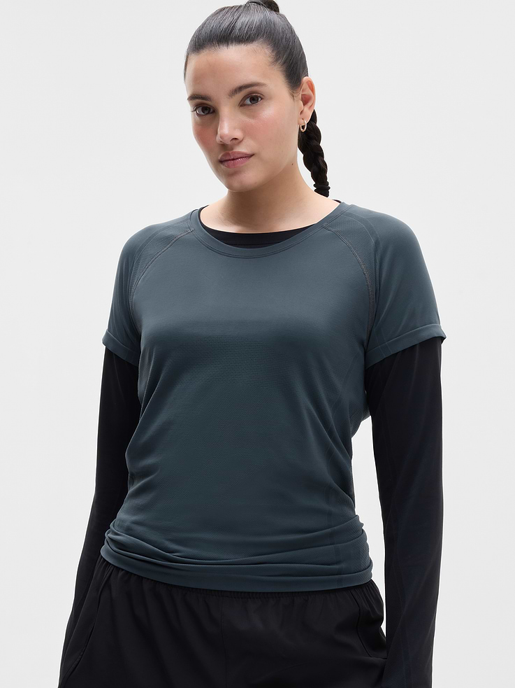 Image 1 of 6, FOR: Medium to high-impact workouts at the gym, studio, or outdoors, FEEL: Enhanced yarns deliver soft stretch and quick recovery, keeping you comfortable while you push your limits, FAVE: The workout top you love, now with upgraded stretch, sweat-wicking power, and sleek style, Seamless construction for minimal chafing, Functional mesh panels allow for optimal movement and breathability, Grippers at inner hem prevent it riding up, Product #845692